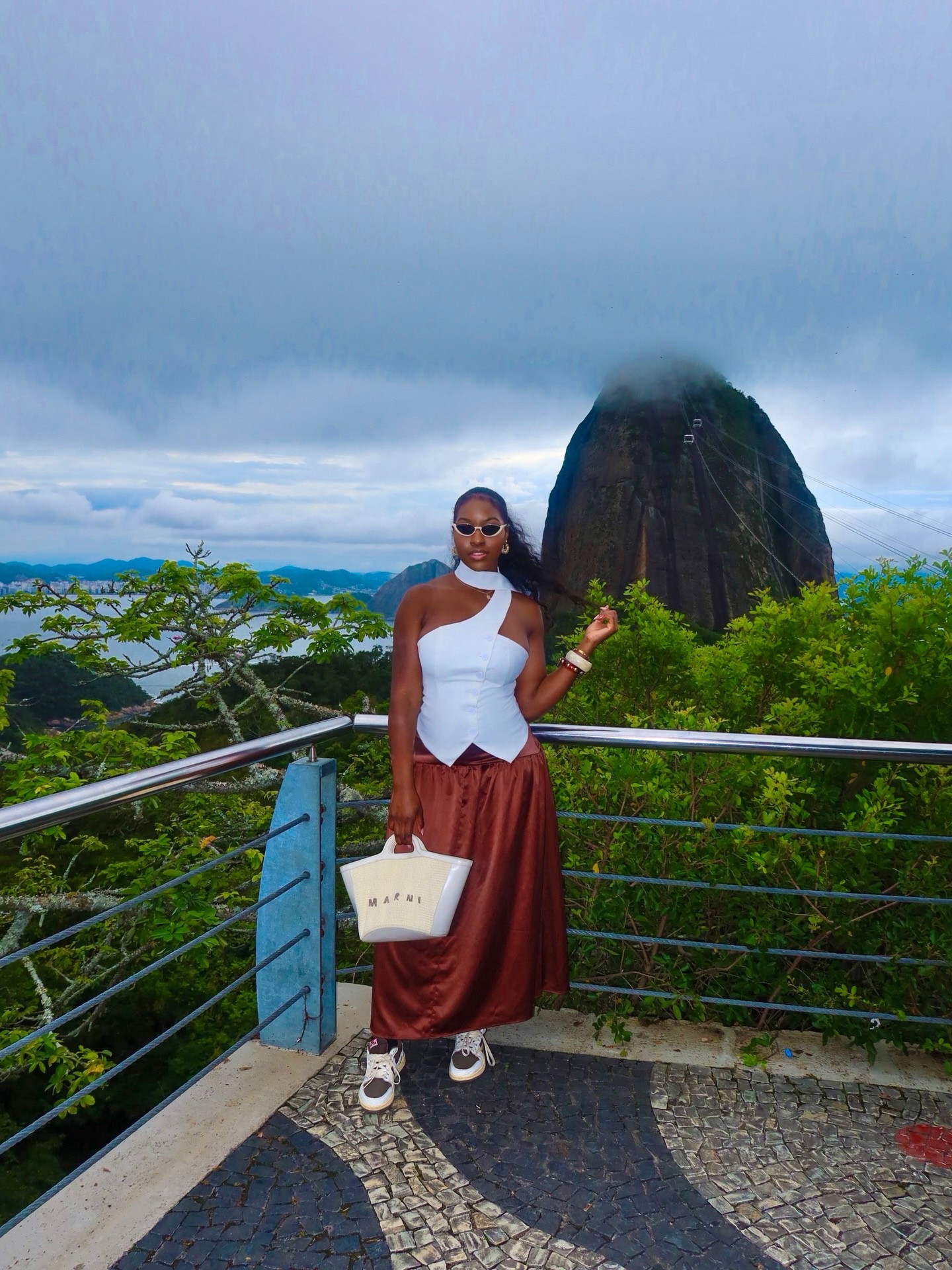 High altitude, higher standards 🤎 🇧🇷

Comment ‘Brazil’ for the outfit link 

Top: @fashionnova 
Skirt: @asos 
Bag: @marni via @farfetch

#LTKTravel #LTKvlog #LTKootd
