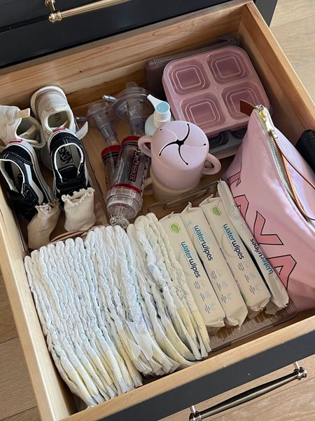 Tayas diaper drawer in the kitchen, dechoker is great to have on hand, snack pouches and containers, extra shoes and socks, diaper and our fave wet wipes 

#LTKkids #LTKfamily #LTKbaby
