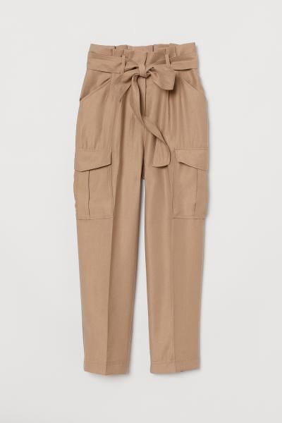 CONSCIOUS
	CONSCIOUS. Ankle-length pants in a woven Tencel® lyocell blend with a high paper-bag ... | H&M (US)