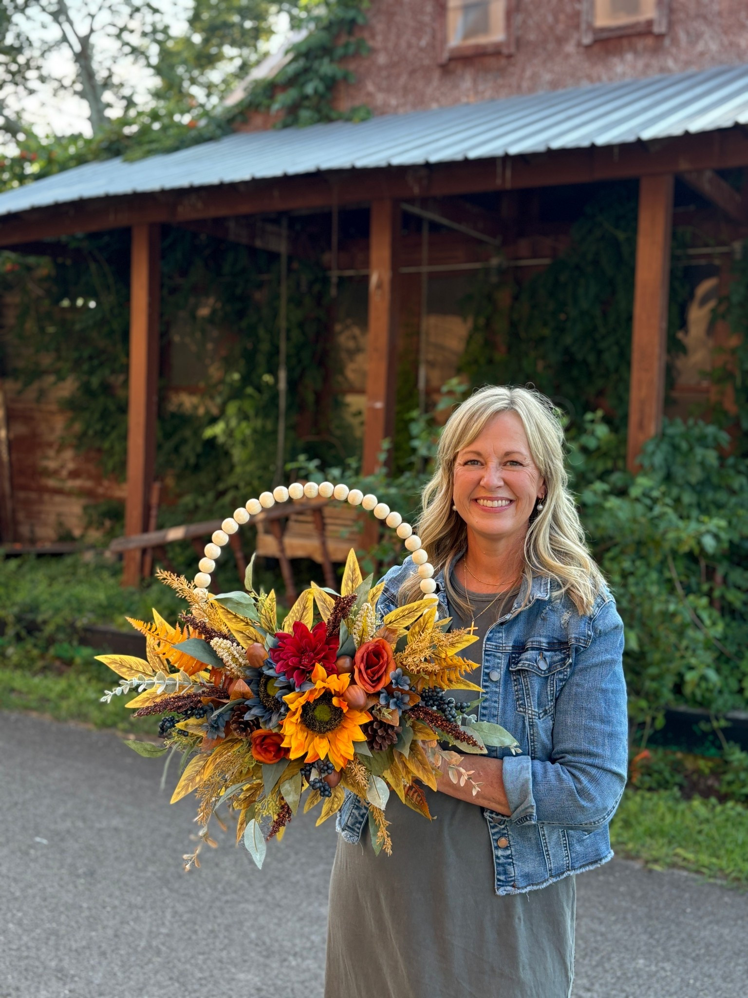 Welcome fall with this handcrafted 14” beaded hoop wreath, extending to approximately 20” with lush greenery and florals. Designed on a natural wood bead frame, this arrangement features a stunning mix of autumn leaves, sunflowers, pinecones, berries, and rich florals in warm golden, rust, and deep red hues. Perfect for welcoming guests at your front door, brightening up an entryway, or adding a cozy seasonal touch to your home decor.


#LTKHome #LTKSeasonal #LTKU