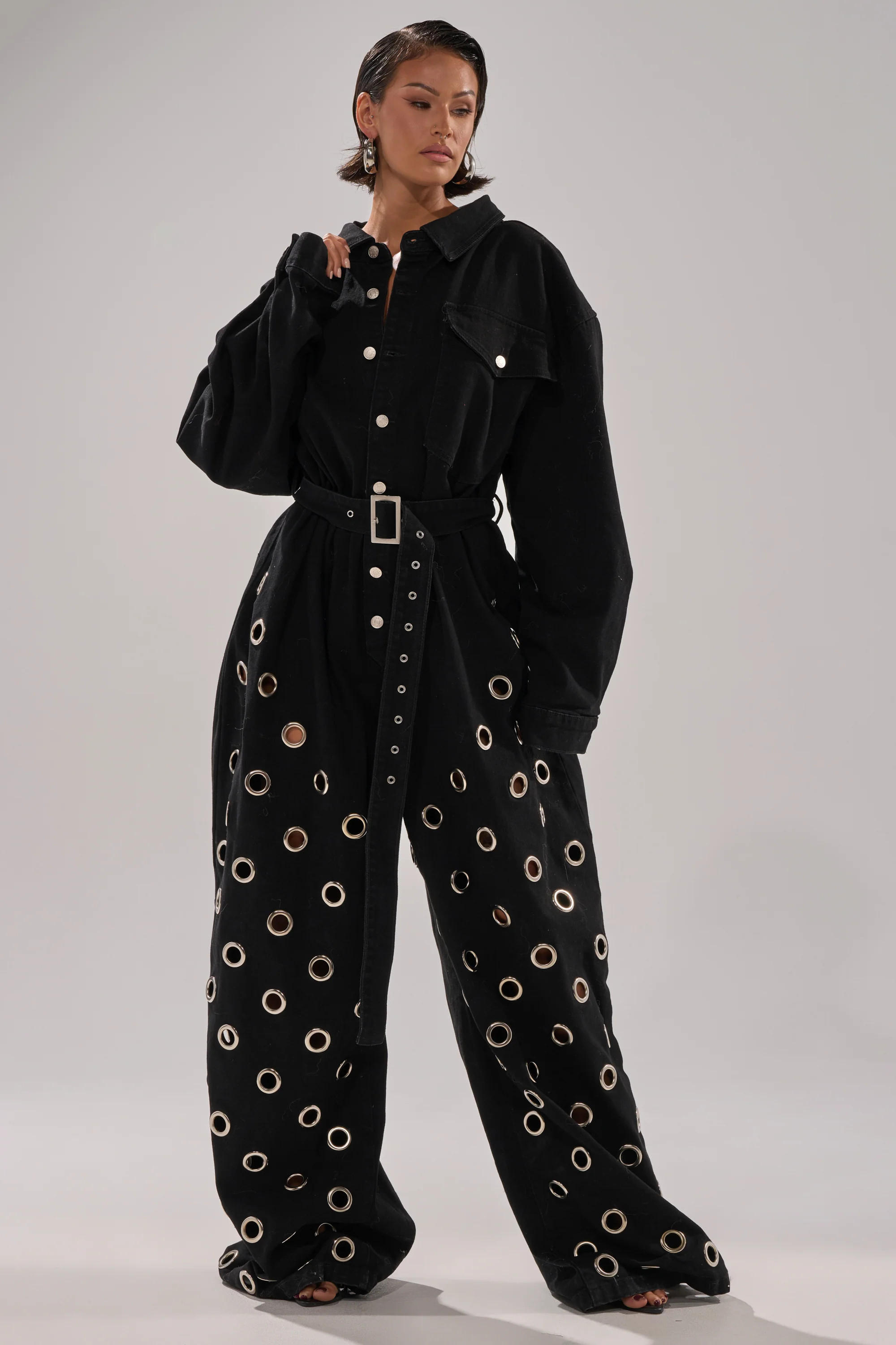 PLAY YOUR CARDS RIGHT DENIM JUMPSUIT WITH GROMMETS | AKIRA