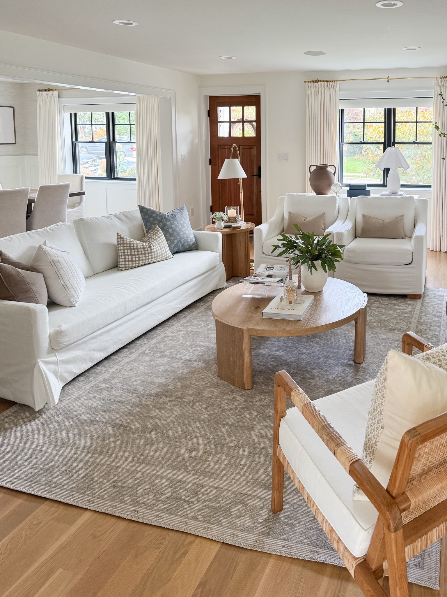 Sneak peek of my mini living room update. I made some affordable changes here because I wanted to switch things up, but wasn’t ready to spend too much. This round Wood coffee table is my new favorite find! I can’t believe how affordable this neutral rug is and you won’t believe the price of my white slip covered sofa.

#LTKStyleTip #LTKSaleAlert #LTKHome