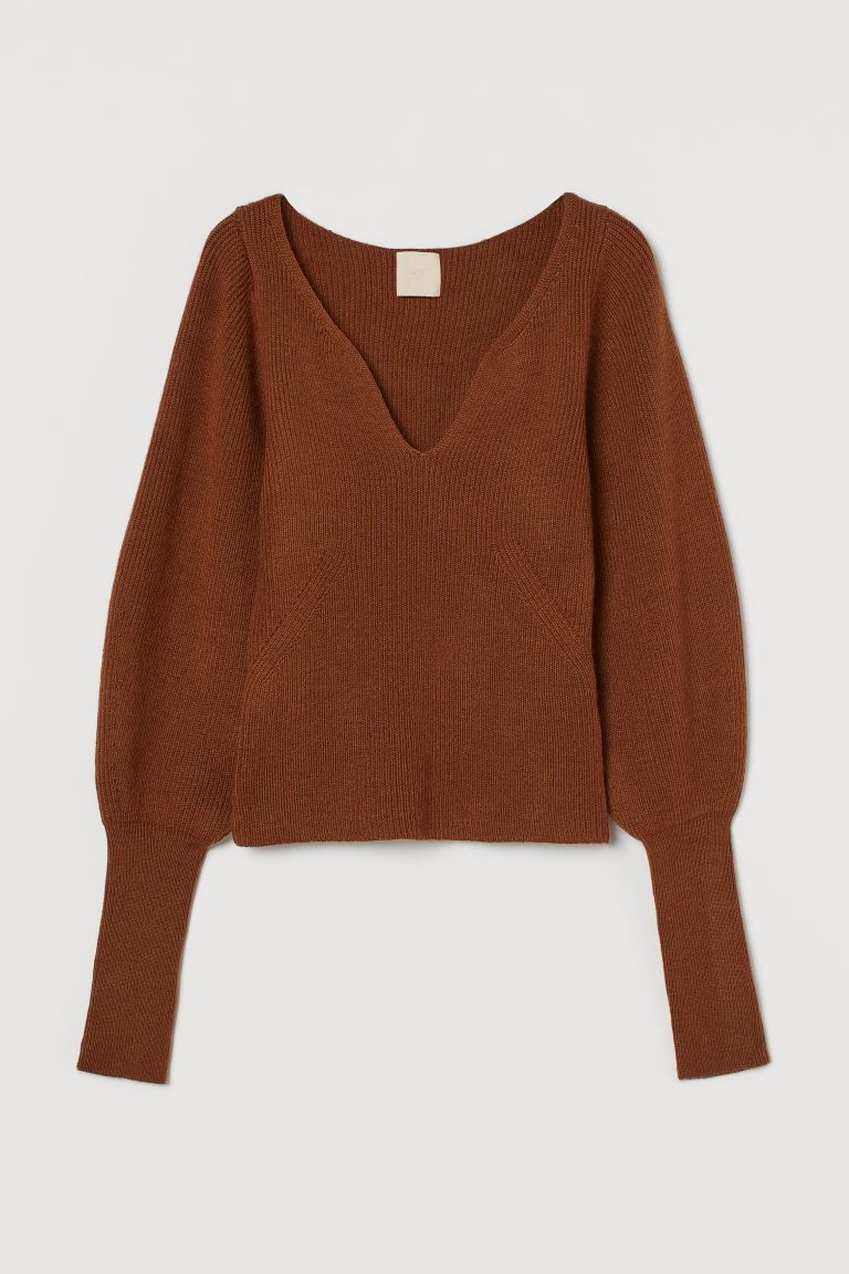 Soft, rib-knit sweater with wool content. V-shaped opening at front and long, wide sleeves with w... | H&M (US + CA)