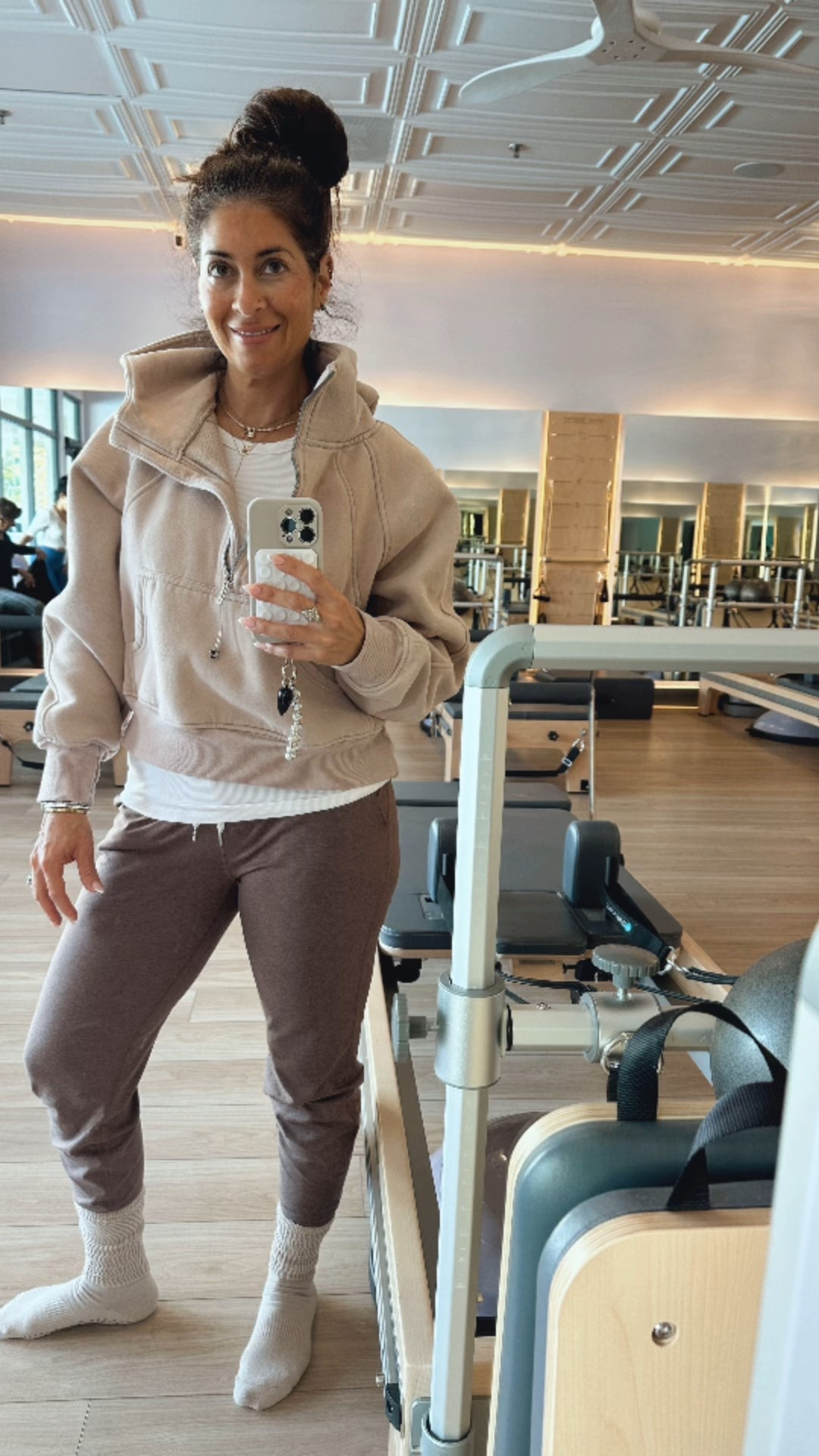 Pilates outfit of the day — loving the neutrals lately. Mixing my fav joggers from Vuori with my easy Amazon sweatshirt and my go-to grip socks. Post-workout, so disregard the messy hair 🤪 #Vuori 

#LTKSaleAlert #LTKCyberWeek #LTKActive