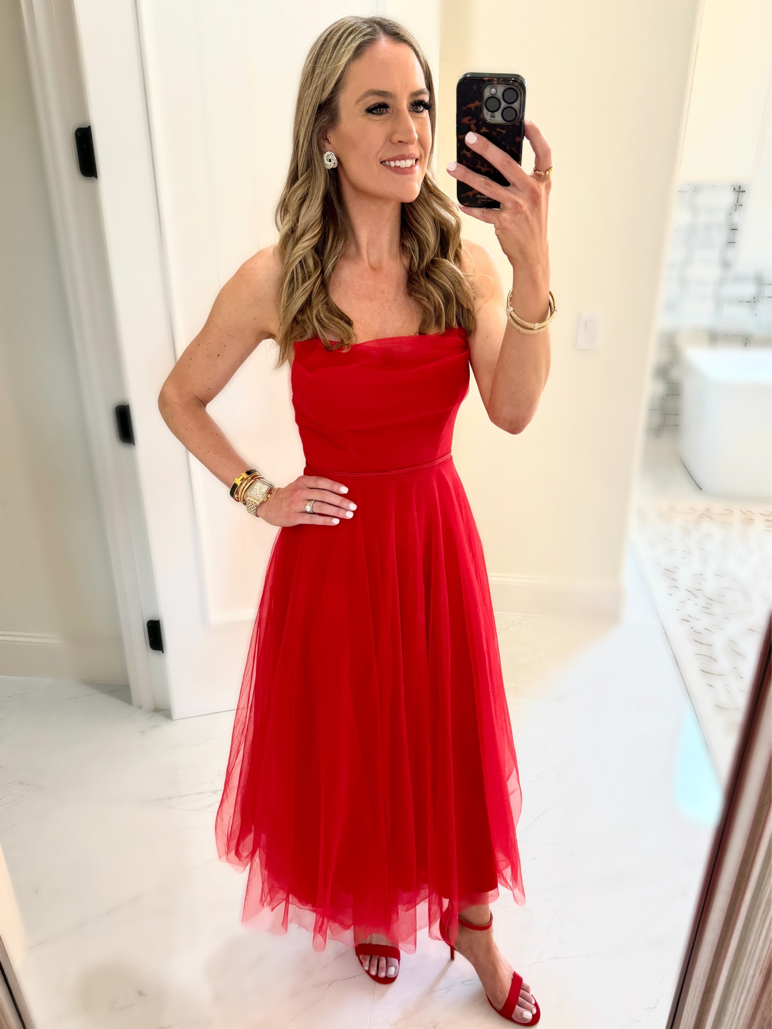 ✨ Holiday Outfit ✨ ‘Tis the season to find the merriest outfits for your holiday cards. This is the dress I wore today for our holiday card photo session (sneak peak 🙈)!!  It fits true to size and comes in other colors. 

Whether red, green, black, or sequins is your go-to for the holidays, you can definitely find a reason to wear this fun, red tulle dress! 

#everypiecefits

#LTKHoliday #LTKover40 #LTKSeasonal