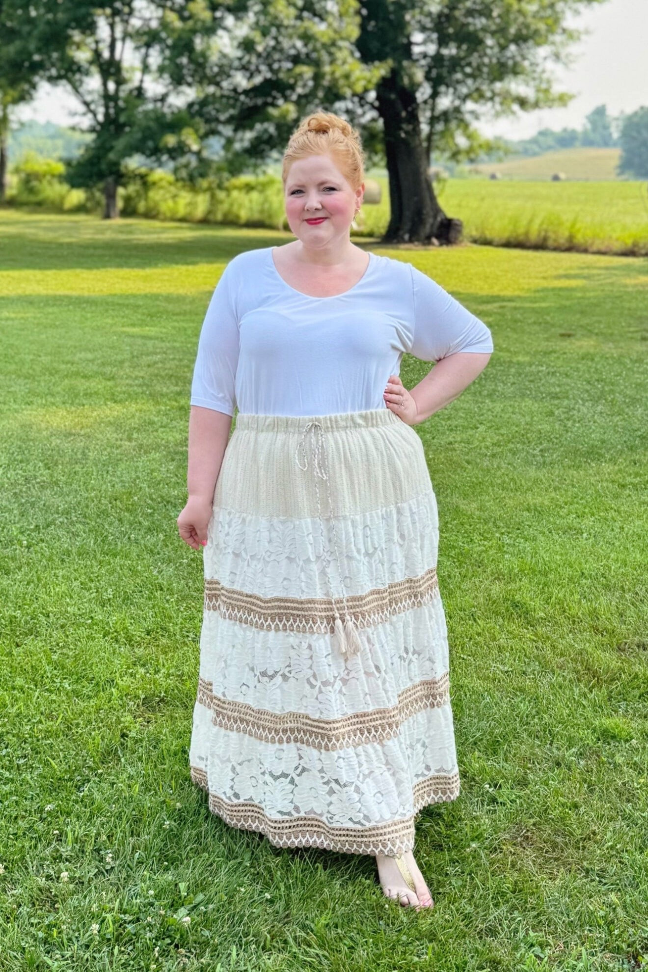 Tee and Boho Maxi Skirt Outfit

I’m wearing this Layered Short Sleeve A-Line Tee (sizes 12/14-28/30; $54.95) in the size 16/18 and Embroidered Lace Maxi Skirt (sizes 12-30; $99.95), I have this tee in several colorways, and it’s one of my favorite t-shirt styles from Ulla Popken. And that’s saying a lot because they’ve become my go-to for solid tanks, tees, and turtlenecks in recent years. Whatever neckline, sleeve length, and color you’re looking for, Ulla Popken’s got it! Now what’s special about this tee is that it’s comprised of two layers of the absolute softest viscose/elastane blend. It drapes beautifully, feels so nice and smooth against the skin, and has good stretch too.

That being said, I did pick the wrong shade to go with this skirt. The skirt photographs more white on the website, but I would have been better off pairing it with an ivory, taupe, or tan top. And while the skirt has an elastic waist, the drawstring detail is purely decorative and doesn’t actually cinch the waist. I went with my larger size 18 in this skirt because I worried about the tier on the hip being too tight, but I should have sized down to the 16 since the skirt has a free and flowy fit, and I needed it snugger in the waist. Use code WWWULLA to shop this top + skirt combo for $100.

#LTKPlusSize #LTKMidsize #LTKootd