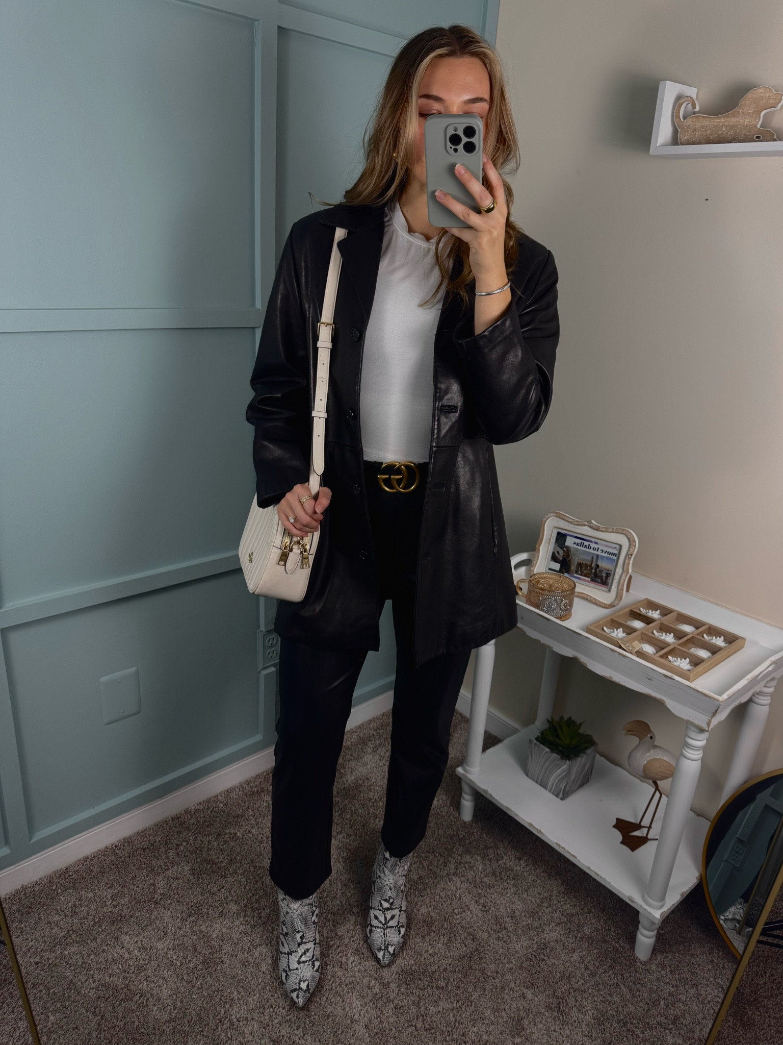 This stylish look features a classic white tee paired with faux leather straight leg pants for a sleek, modern vibe. A chic leather blazer adds a sophisticated edge, while a white Coach shoulder bag offers a polished finish. Snakeskin booties complete the outfit with a touch of bold texture. Perfect for day-to-night wear! #LeatherBlazer #FauxLeatherPants #CoachBag #SnakeskinBooties #OOTD #ChicStyle #FashionInspo #LuxuryLook #CasualChic #EffortlessStyle

#LTKStyleTip #LTKWorkwear #LTKShoeCrush