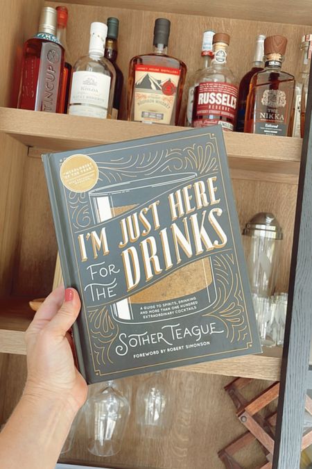 Cocktail book for my home bar cabinet. 🍸🍹🍷

#ltkhome #homebar #curiocabinet #storagecabinet #displaycabinet