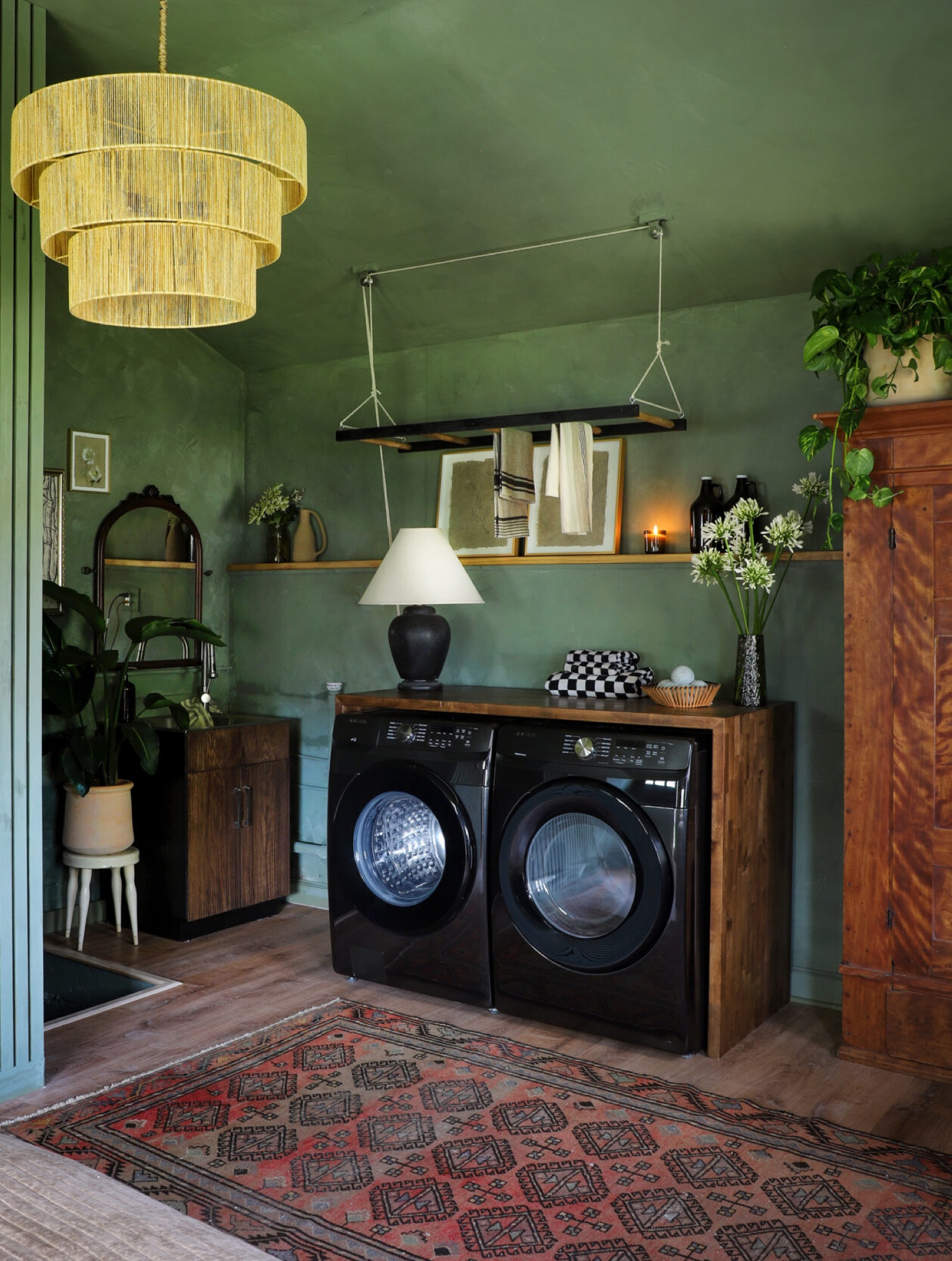 On the premiere of season two of Makeover by Monday, I transformed the laundry sink by painting it, and wrapping the doors in pole wrap, and then staining it to mimic the slat walls aesthetic. This DIY took a basic laundry sink, and gave it a modern look.

#LTKhome