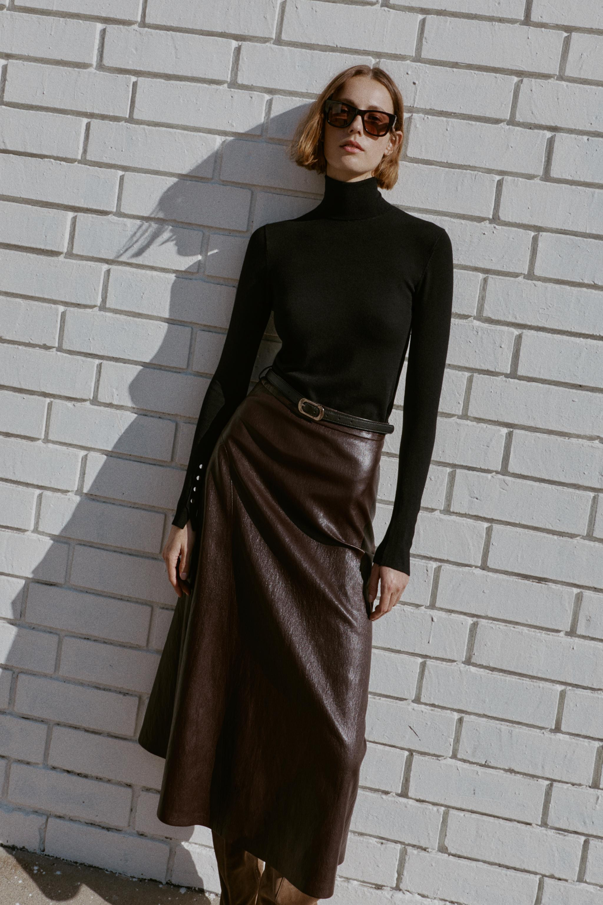 Plain knit jumper with main fabric made of 100% wool yarn. High collar and long sleeves. Thin bel... | Zara US