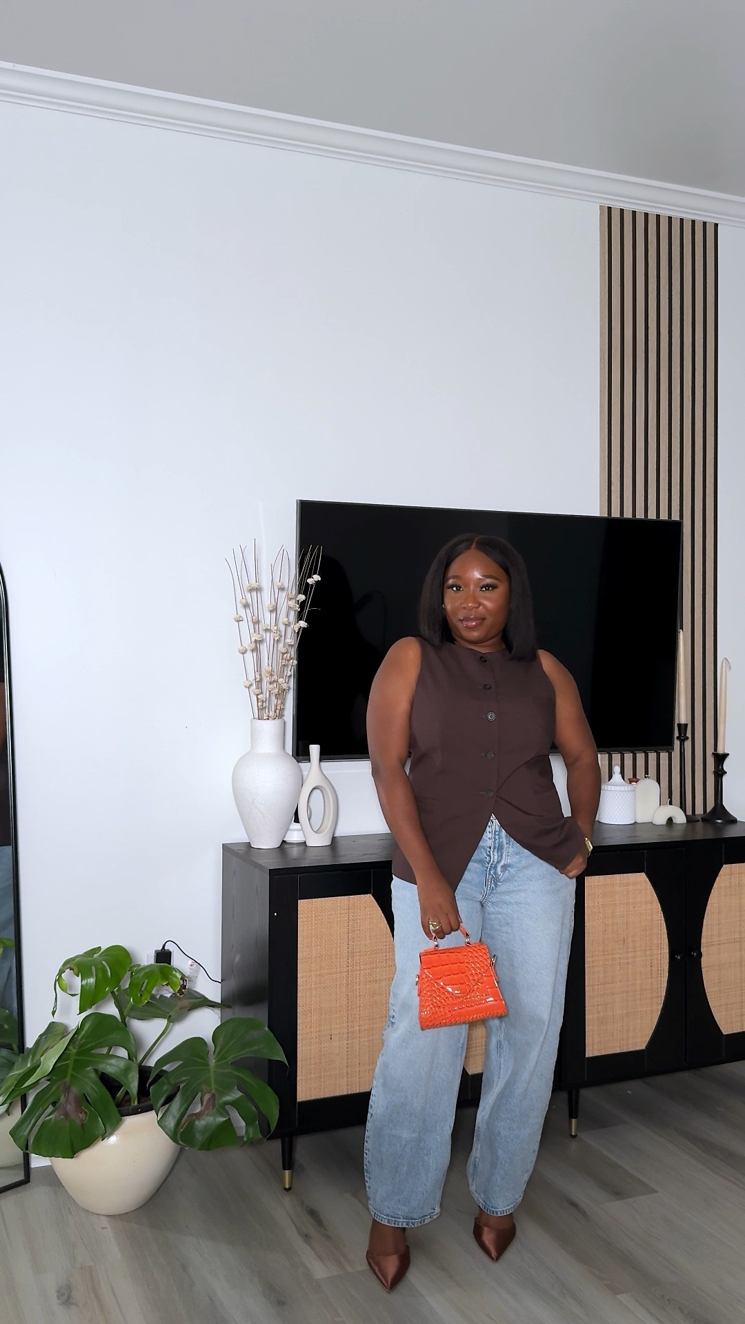 A chic but fun fall inspired outfit 🤎
Paired my barrel jeans with this brown vest waistcoat, brown heels and an orange purse as a pop of color. 

Fall Fashion. Modest Style, Chic style, Minimalist Style 

#LTKVideo #LTKSeasonal #LTKStyleTip