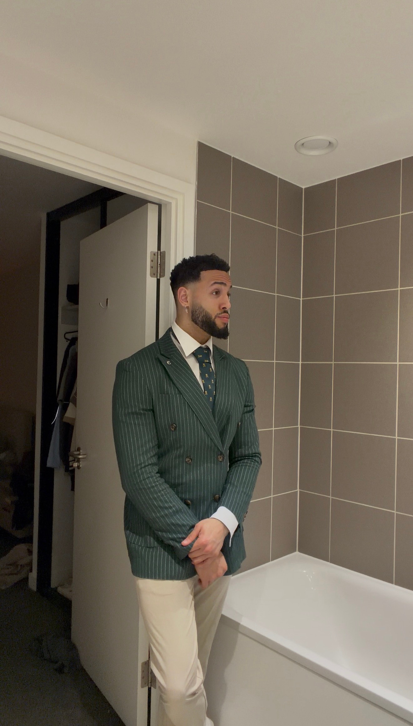 Green pinstripes and cream trousers for a sharp occasion look. A double-breasted blazer, crisp white shirt and patterned tie make this an easy wedding guest or race-day outfit. Shop similar pieces below.

Mens formalwear | green blazer | cream trousers | wedding guest outfit 

 