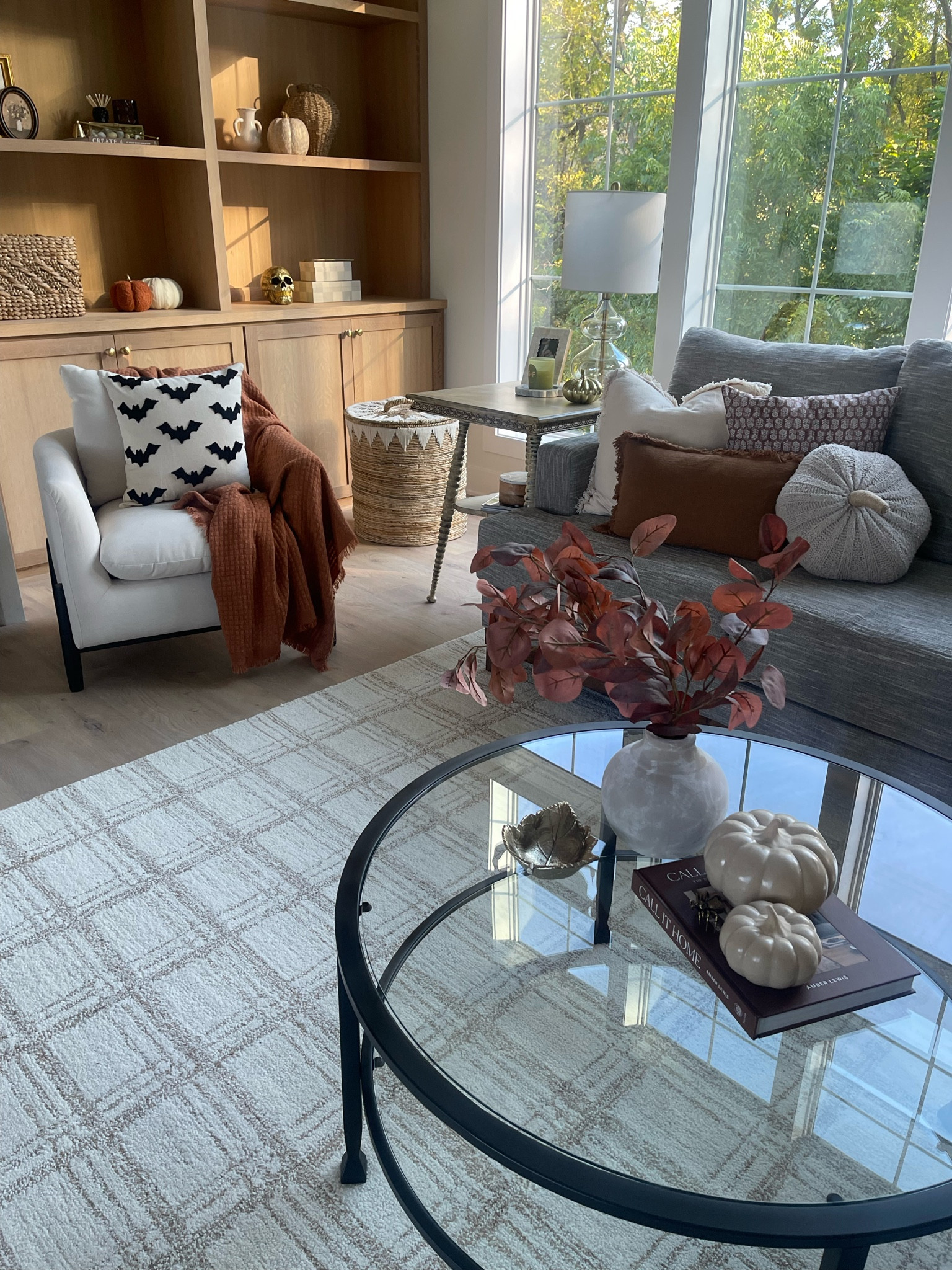 Fall home decor // Halloween home decor // bat throw pillow cover // pottery barn tanner coffee table // Elroy accent chair from Target // Chris Loves Julia Loloi Polly neutral area rug // 

#LTKSeasonal #LTKHome