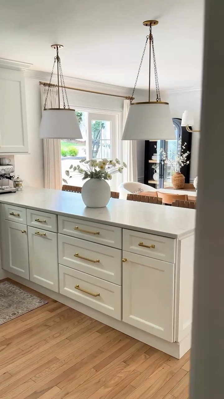 POV: When lighting changes everything ✨

Our ceilings are only 8 ft, but that didn’t stop me from creating a kitchen that feels designer and cozy. These pendants completely elevated our kitchen makeover and made the space feel so much more us.🤍


#kitchenmakeover #neutralhome #ltkhomedecor #modernorganic #pendants #kitchenlighting

#LTKHome #LTKStyleTip