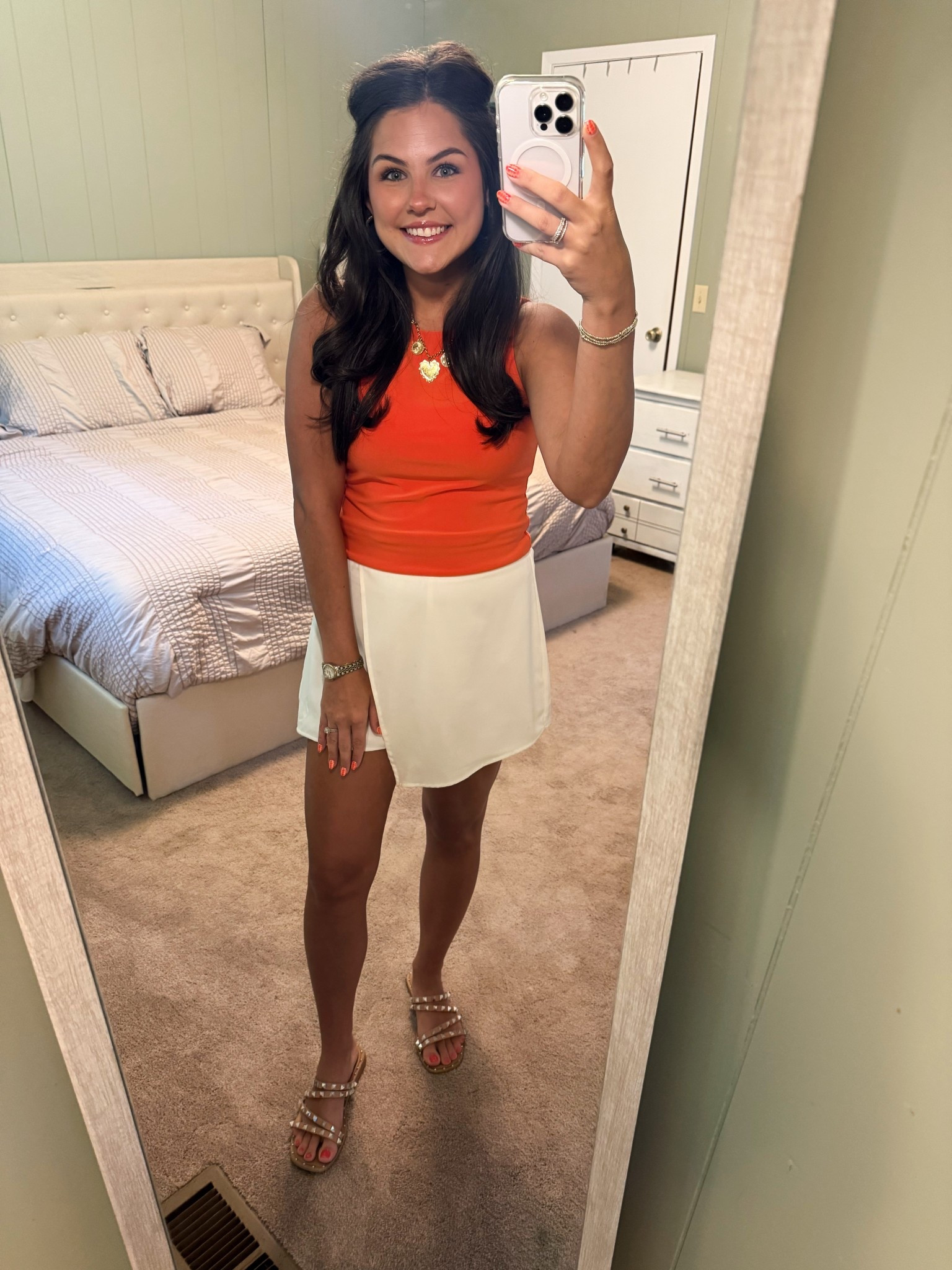 This bright and breezy look is giving summer chic 🍊🤍 I’m obsessed with this pop of orange and the flattering wrap detail on the skirt! Perfect for a day out or casual date night 🌞 Linking everything (or similar pieces), including these studded sandals that go with *everything!*✨ #LTKStyle #LTKSummer #GRWM