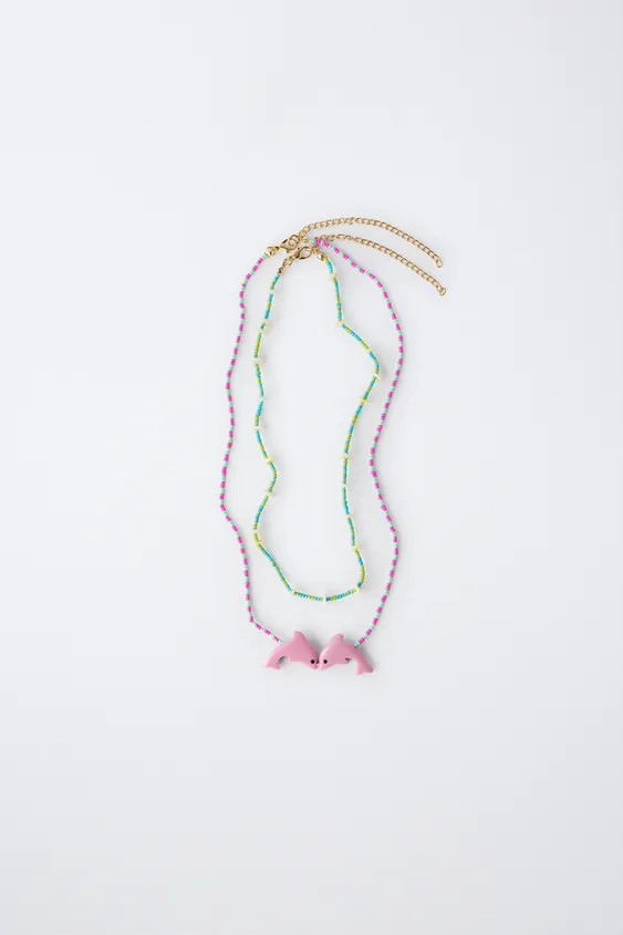 Pack of two beaded necklaces with adjustable nape closure. Featuring dolphin-shaped pendant detai... | Zara US