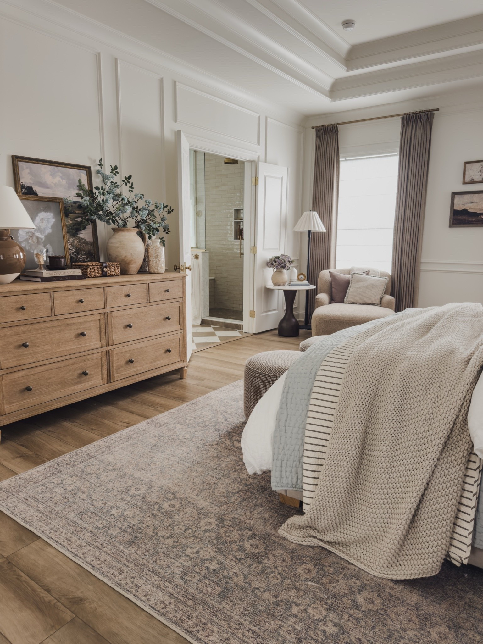Primary bedroom inspo styled for summer! Simple swaps such as blue florals and cozy layered bedding while still highlighting my quality furniture staples and vintage inspired area rug.

Home finds, neutral home inspo, collected style, primary bedroom refresh, timeless home inspo, layered bedding, pops of blue, neutral wood tones, vintage inspired area rug, cozy chaise lounge, floor lamp, pinch pleat curtain, collected decor, Pottery Barn style, Target style, Emtek, Wayfair, Four Hands, Galey Alix, McGee and Co, shop the look!

#LTKSeasonal #LTKHome