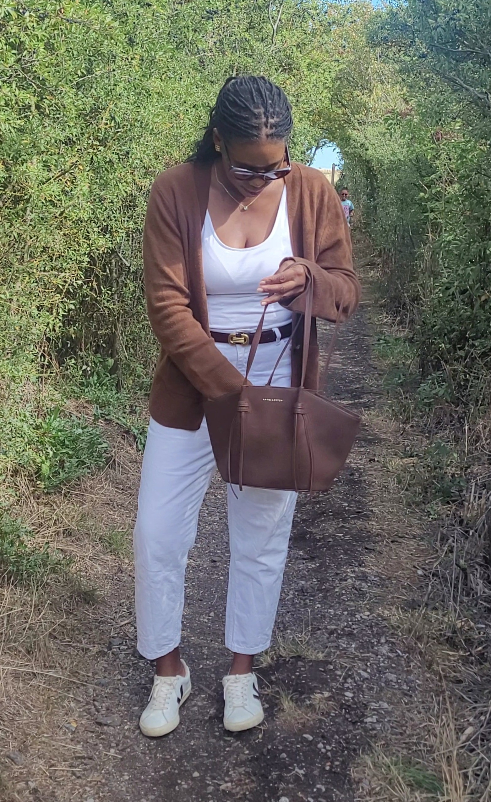 Easy transitional outift 🍂White jeans, white vest, brown cardigan, brown bag, veja trainers.#falloutfitinspo #fallfashion #modestfashion #fashiontrends 

#LTKautumn #LTKjeans #LTKmidsize