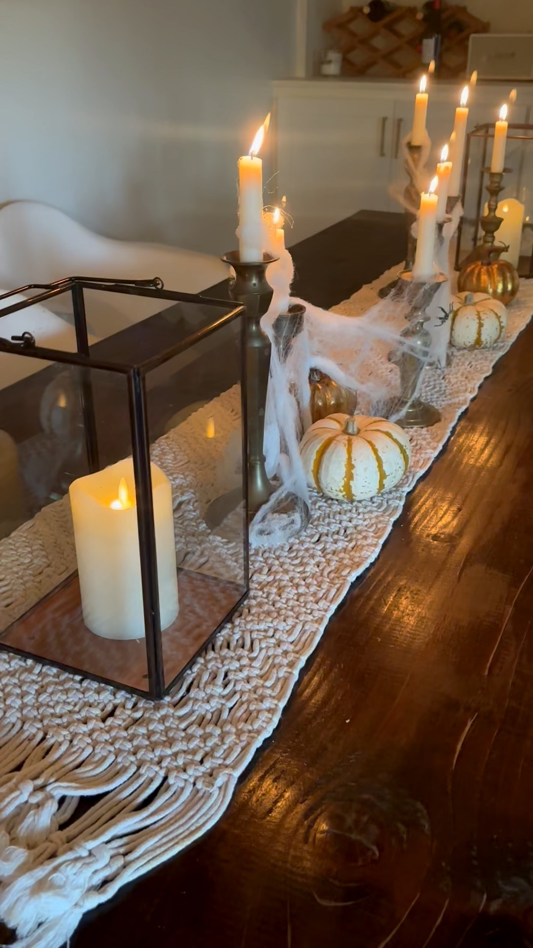 Easy fall centerpiece idea- thrifted candle sticks, some flameless candles, real and faux pumpkins.  Cover the whole thing in spider webs this month, then take it off after Halloween.  

#LTKSeasonal #LTKHalloween #LTKHome