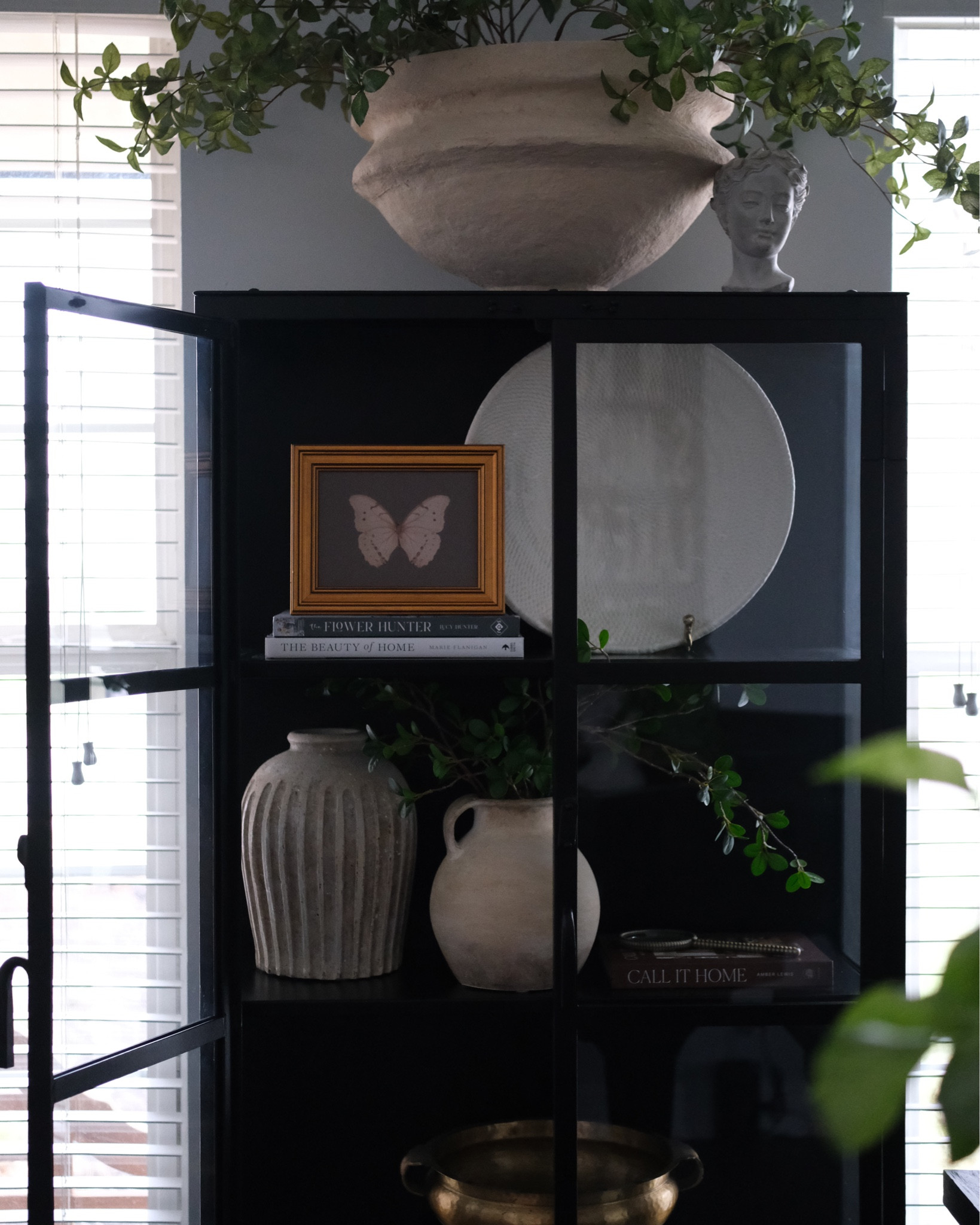 Refreshing spaces throughout my home and adding seasonal art like this butterfly moment on my cabinet shelf, available in several sizes. 

#LTKHome #LTKSeasonal