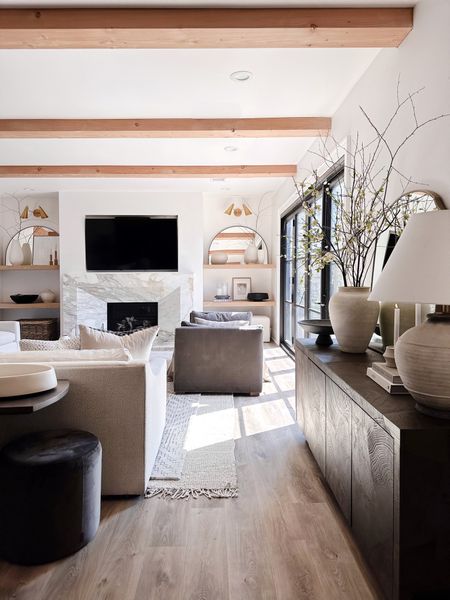 Our Family Room is one of my favorite spaces in our home. It has that Modern Organic European flair that I would love to have throughout an entire home. 

Sofa. End tables. Sideboard. Console table. Throw pillows. Faux greenery. 

#LTKSeasonal #LTKhome #LTKfamily