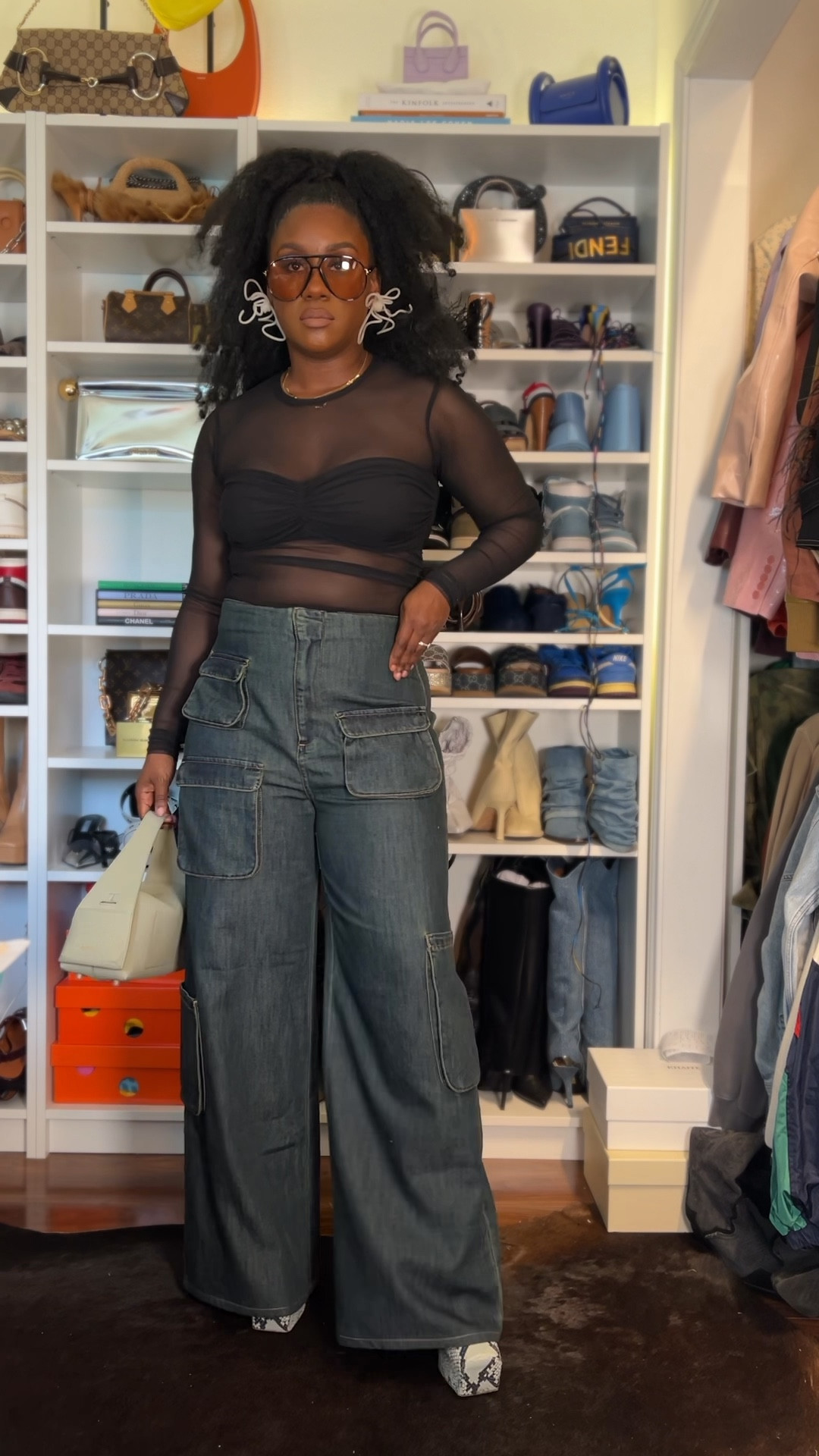 Fitted cargo high waisted jeans and mesh long sleeve ruched top with platform heels and jade leather handbag 