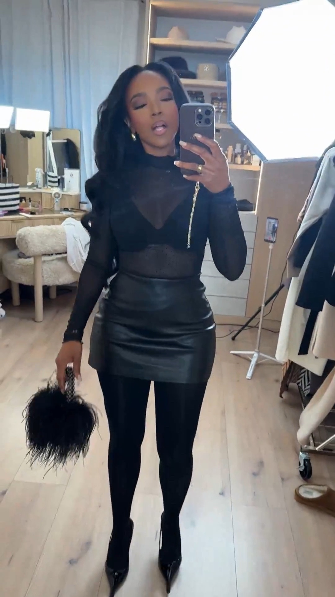 Bold, confident, and made for a night out — this all-black look is serving texture, edge, and effortless confidence. The sheer detailing paired with the leather mini instantly elevates the outfit, while tights and pointed heels keep it polished and wearable.

Perfect for date night, girls’ night out, cocktail events, or an evening birthday look.

📏 Sizing & fit details:  
Top: Size Small  
Skirt: Size Small  
Tights: True to size  
Heels: True to size  

Measurements: 5'4" | 138 lbs | 34D bust | 27" waist | 40" hips  
For jeans in similar looks: 27 Long or 4 Long  
For cargos or sweats when a baggier fit is desired: size Medium or size up

Tap to get details and shop this look instantly — pieces like these are timeless staples that can be styled multiple ways, making the cost per wear drop fast.

Follow me on Instagram and YouTube @kirasfashionfinds