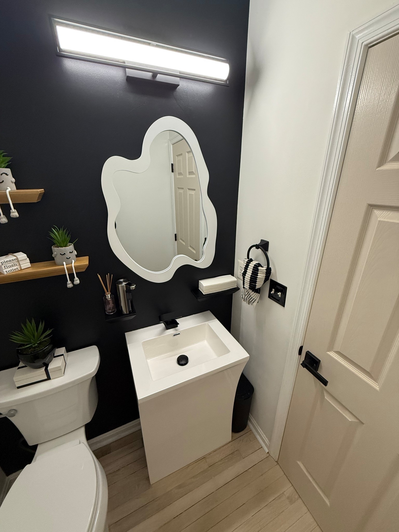 This curvy white mirror is the perfect statement piece for a half bath. The soft, sculptural shape adds a modern touch while still feeling light and airy. It instantly elevates the space, making the bathroom feel brighter, more open, and thoughtfully styled. A simple upgrade that makes a big design impact.

#LTKmomlife #LTKHome #LTKBeauty