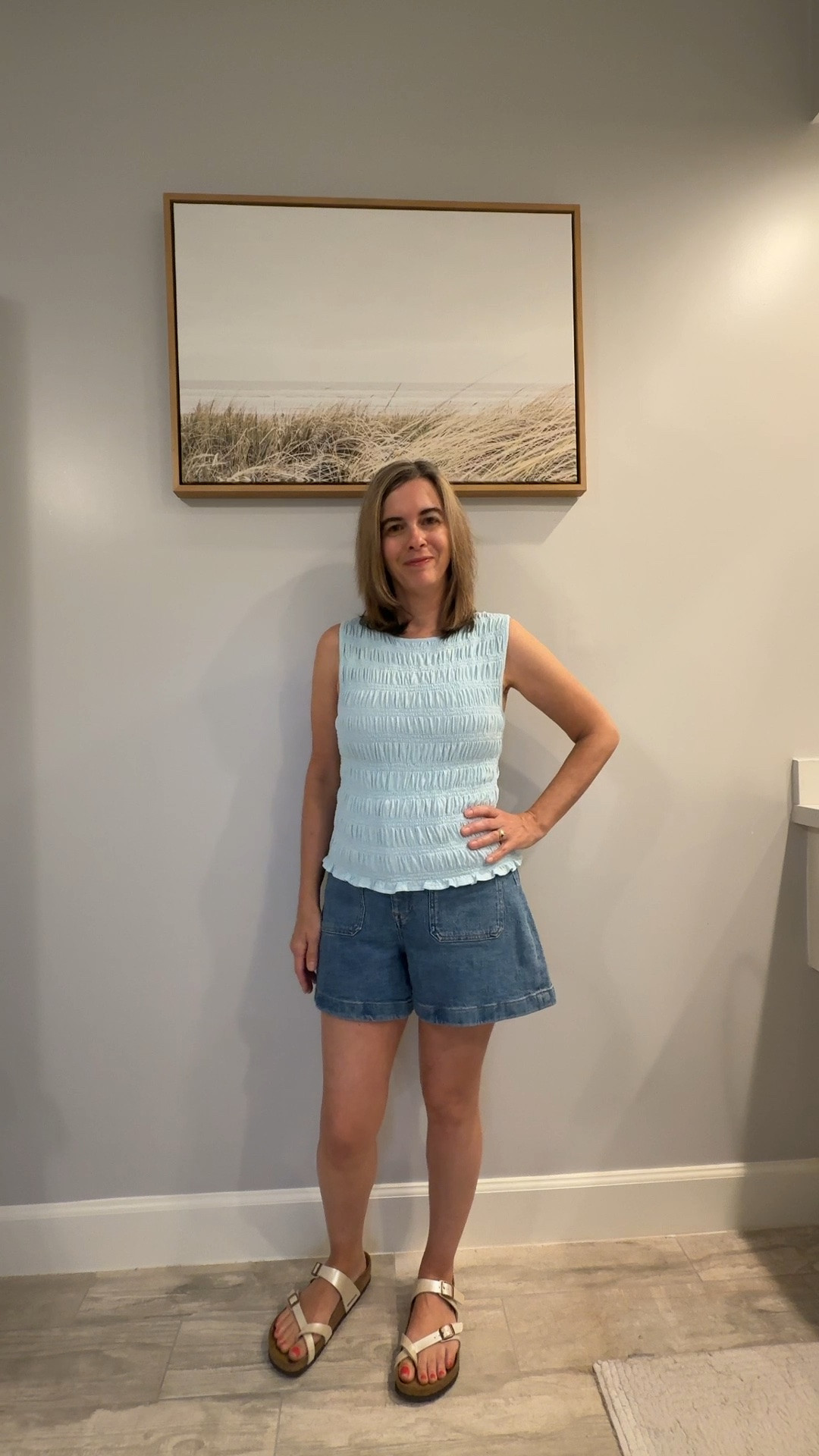 Summer outfit comfort! 🤍 I’m wearing a sleeveless smocked top with a pair of classic denim shorts. These Madewell shorts are curvy which gives me a more relaxed look. They also come in regular fit. I styled them with my Birkenstock sandals for additional comfort. This summer outfit could also be styled with wedge sandals for a dressier look!

#LTKootd #LTKOver40 #LTKPetite