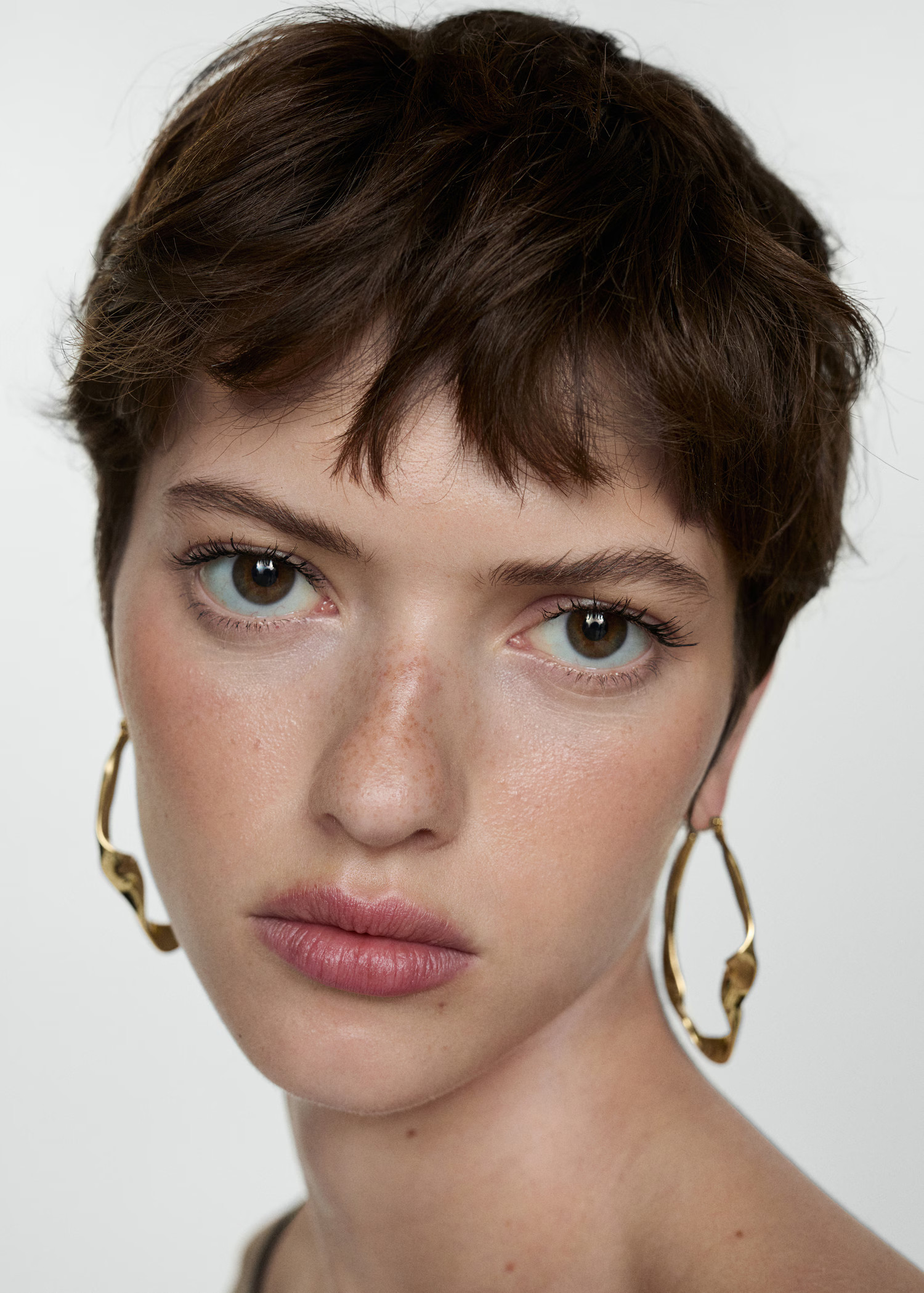 Twisted hoop earrings - Women | MANGO United Kingdom | MANGO (UK)