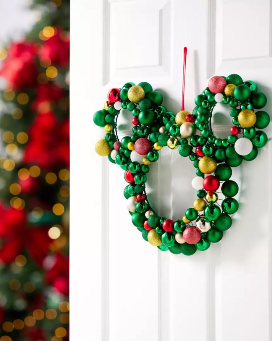 This charming Mickey icon wreath will add a festive flair to your front door, welcoming carolers, freinds and family gatherings alike, to fill your home with holiday cheer! It's made up of glittering ornament balls to evoke your tree décor.

#LTKSeasonal #LTKHome