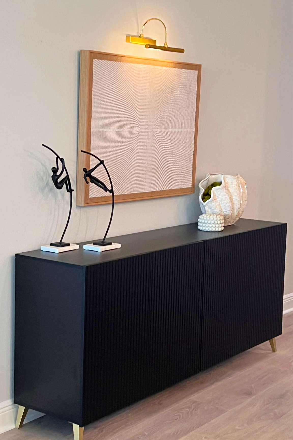 This Sideboard is so versatile and beautiful! Made from wood, metal legs for contrasting colors and materials. So chic, also has beautiful wainscoting details in the front. Ideal for a bar, dining room or living room. Really impressive with the quality! 
#console 

#LTKSeasonal #LTKHome #LTKStyleTip