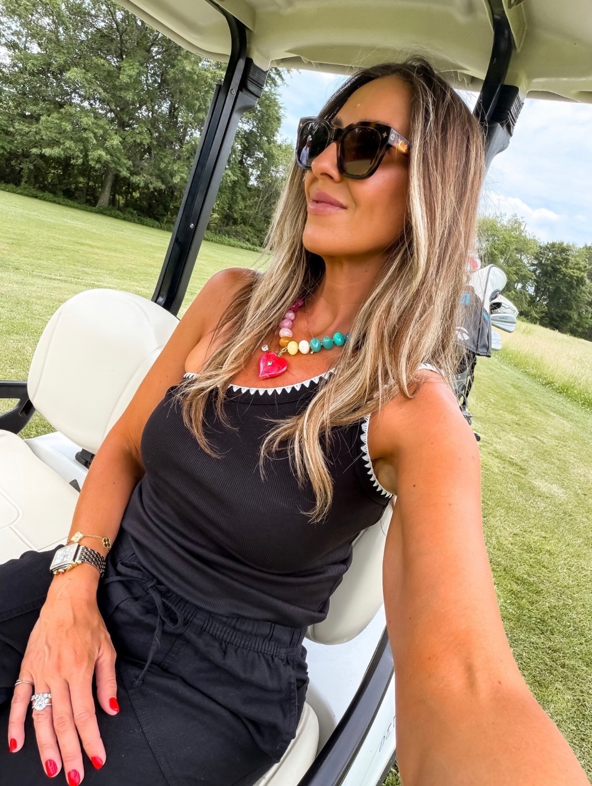 This top set is one of those that goes with much and makes getting dressed ridiculously easy. The contrast trim adds just enough detail, and the colorful statement necklace takes it from basic to styled in seconds. Perfect for golf days, errands, lunch with friends, or travel.

black tank, golf outfit, casual chic, travel outfit, everyday style, summer outfit, comfortable fashion, statement necklace, athleisure style, vacation outfit, easy outfit idea, black outfit, mom style, themominstyle

#LTKootd #LTKOver40 #LTKSeasonal