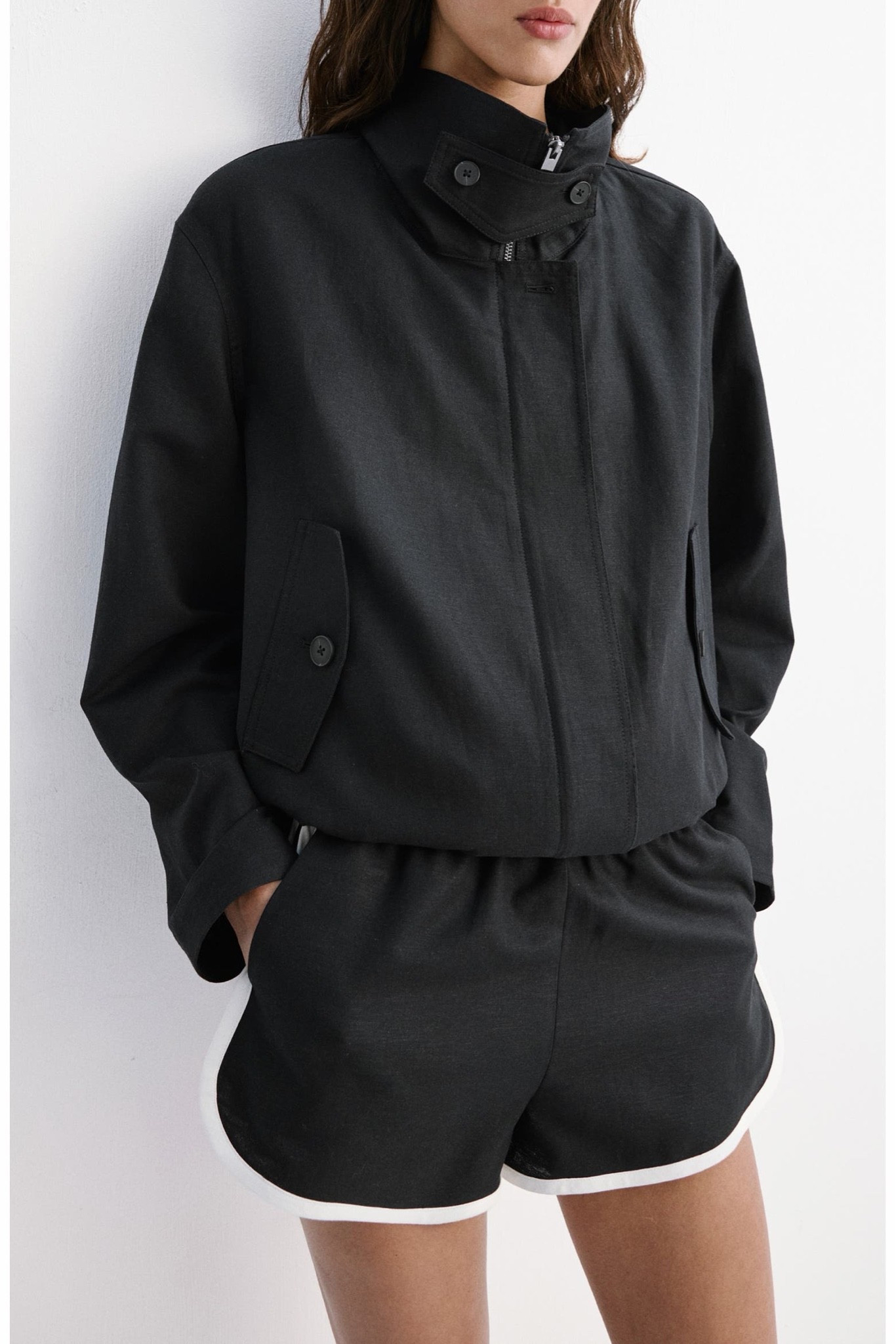 This funnel-neck bomber jacket is one of those elevated basics that instantly makes an outfit look more polished. The linen and cotton blend gives it a lightweight feel that’s perfect for the transition into fall, while the sporty silhouette keeps it modern and effortless. It’s the kind of quiet luxury piece you’ll throw on with denim, leggings, tailored trousers, or matching shorts all season long.

I sized my usual size for the relaxed fit.
