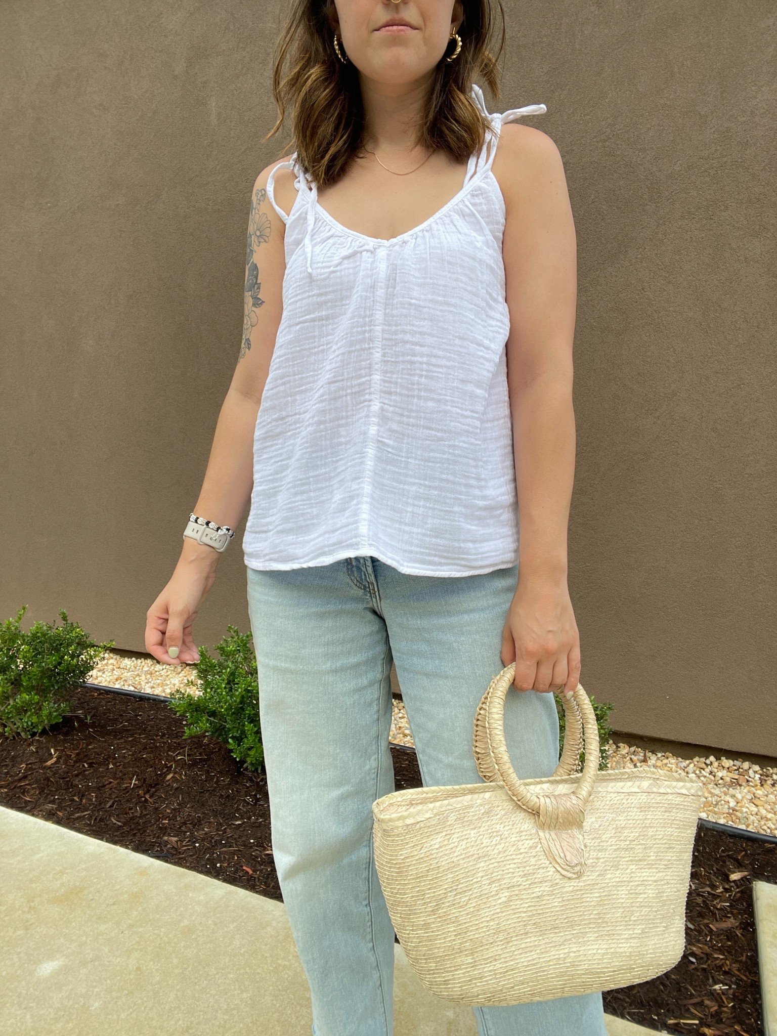 Summer outfit, vacation outfit, vacay outfit. White flowy square tank top from Old Navy, I linked similar ones, light wash denim from Old Navy, straw purse and a gold necklace. #ltksummer #vacationoutfit #summerfashion #summerstyle #ltkpurse #vacaystyle 

#LTKFindsUnder50 #LTKSeasonal #LTKStyleTip