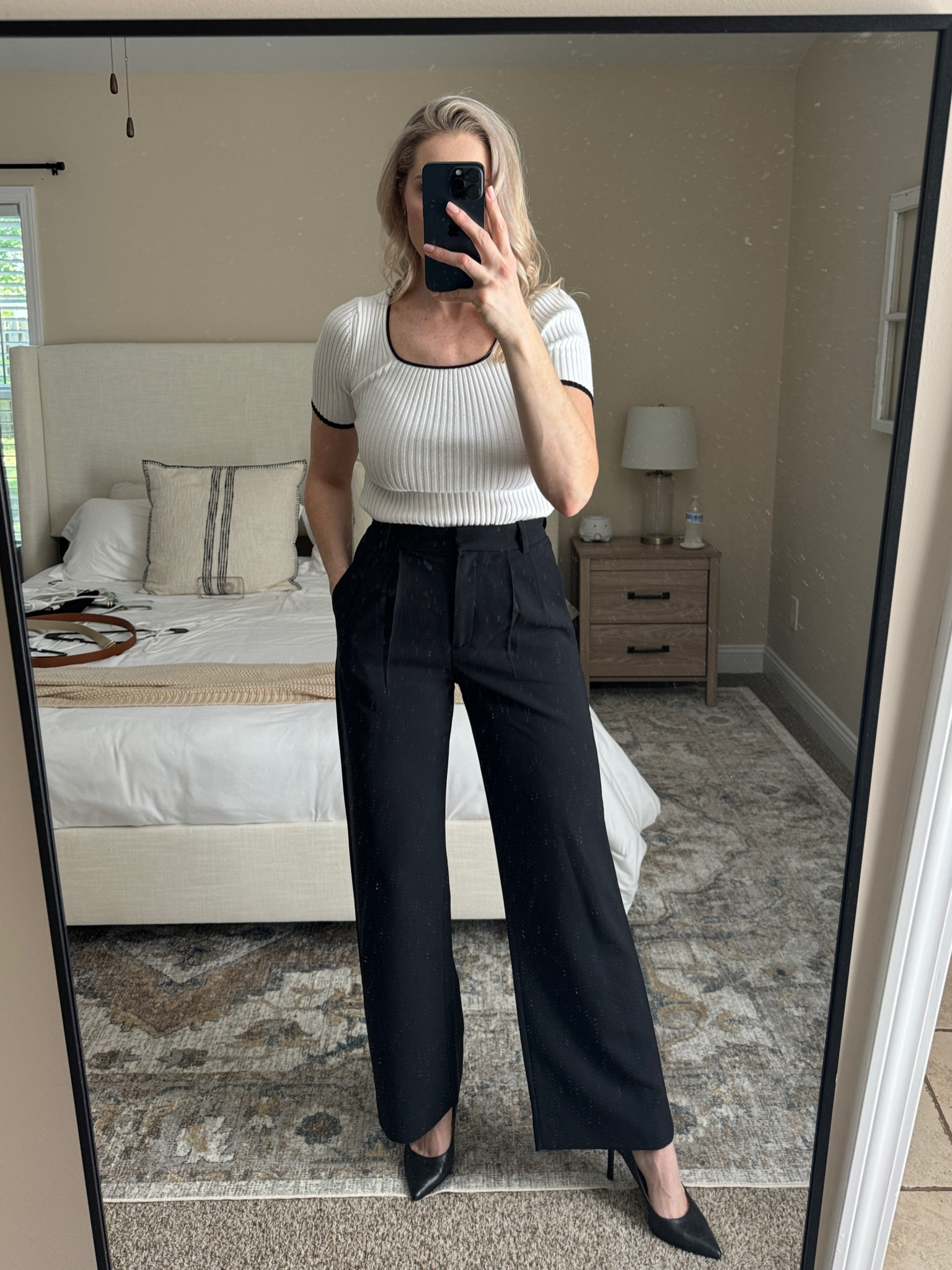 White knot top with black trousers and black heels. 

#LTKfindsunder100