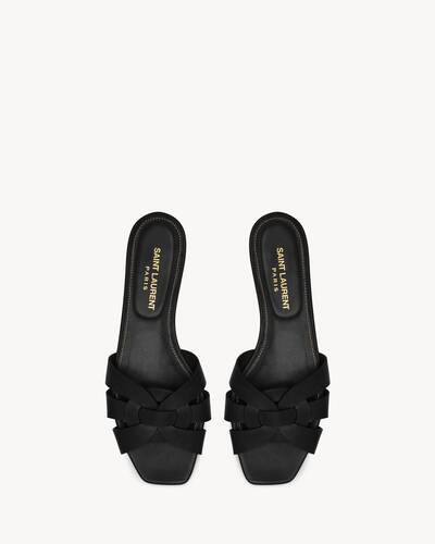 slip-on sandals made with metal-free tanned leather, featuring a square toe and intertwining stra... | Saint Laurent Inc. (Global)