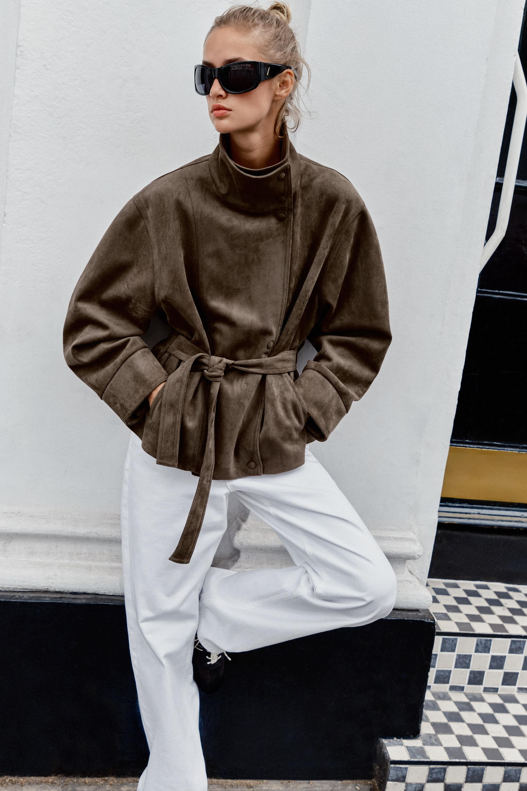 Jacket with a high collar and long sleeves. Front pockets. Featuring a matching fabric belt and g... | Zara UK