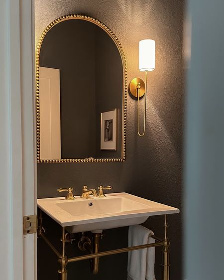 Moody powder room decor including this gorgeous Amazon beaded arch mirror, sconces, and console sink!



#LTKStyleTip #LTKSaleAlert #LTKHome