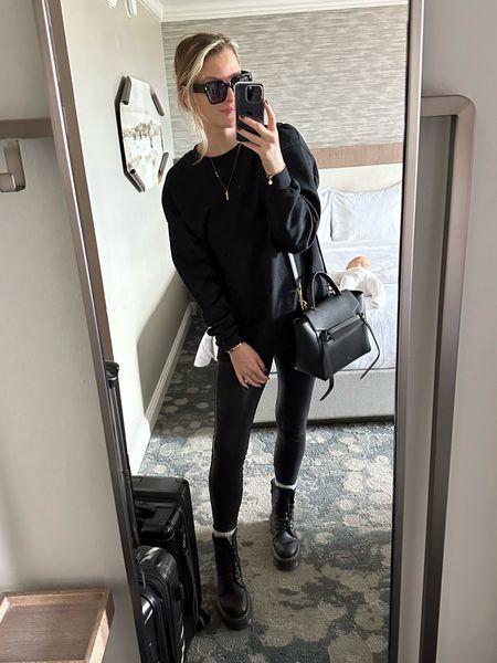 All black travel outfit, gold, hoops, dr. martens outfit, mom style, travel style, faux leather leggings, spanx leggings 