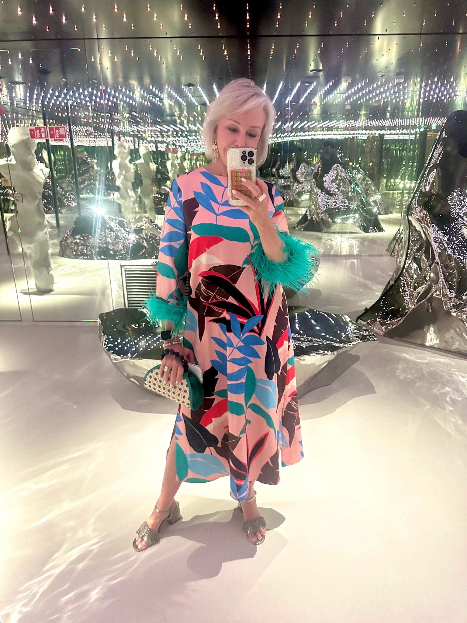 Resort-wear @tuckernuck This dress also comes in 2 solid colors. Yellow and pink. How about the ostrich feather. Yes!! It is so fun!! @kendrascott statement earrings are perfect with this dress. Perfect for a cruise or warm weather vacation!! This print sold out but I link a similar dress that is so cute and on sale. 
#Tropical print #mididress #resortwear 

#LTKtravel #LTKSeasonal #LTKover40