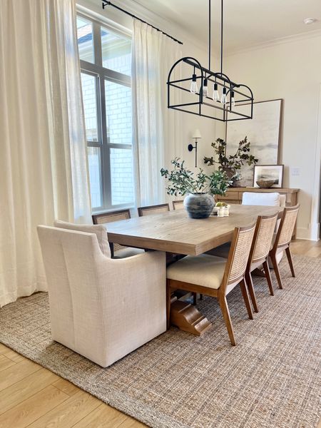 My dining room is the perfect combo coastal meets California casual. Upholstered dining chairs, white oak dining table, cane dining chairs 

#LTKhome #LTKfamily #LTKsalealert