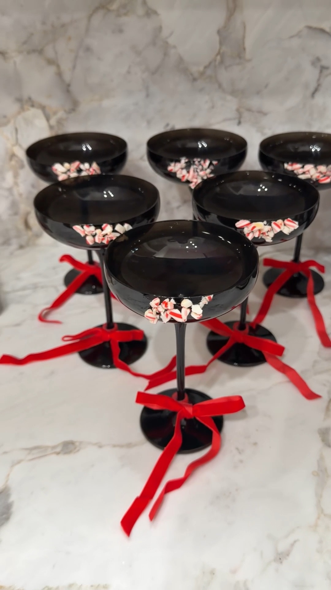 Christmas party decor
Holiday decor
Black martini glasses
Bows for glasses 

#LTKHoliday #LTKSeasonal #LTKHome