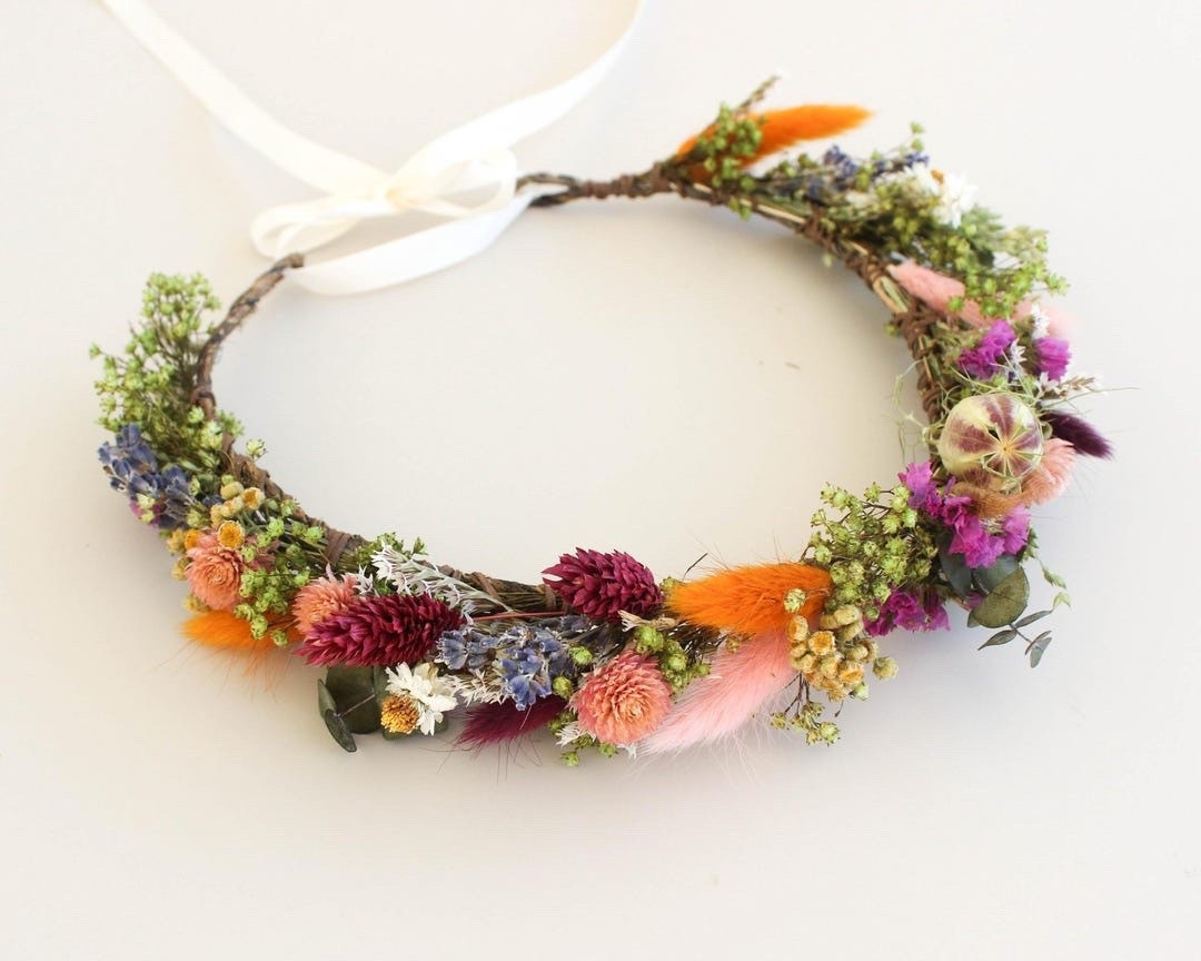 This delicate dried flower crown is the perfect finishing touch for weddings, bridal showers, baby showers, birthdays, and flower girl moments. Handcrafted with neutral-toned daisies, lavender, blush blooms, greenery, and soft orange accents, it brings a romantic touch of nature to any special occasion. Lightweight, comfortable, and finished with an adjustable tie-back, this keepsake piece is as beautiful as it is timeless. #DriedFlowerCrown #FlowerGirlCrown #BohoWedding #BridalShower #BabyShowerIdeas #WhimsicalWedding #PreservedFlowers #RusticWedding #LTKWedding #FloralAccessories

#LTKWedding #LTKKids #LTKSeasonal