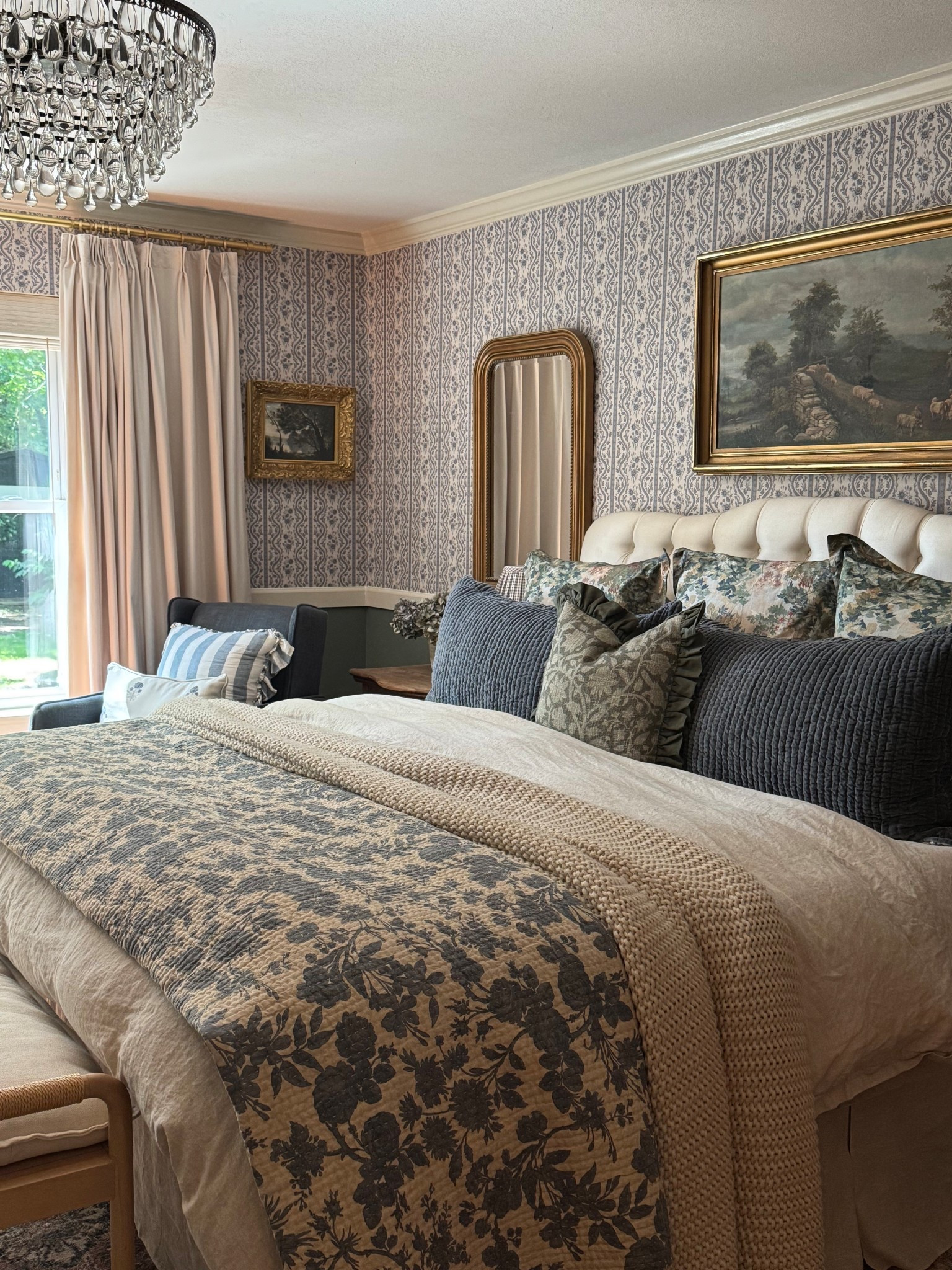Cozy bedroom, layered bedding, reversible floral quilt, blue floral quilt, chunky knit throw blanket, velvet reversible shams, linen duvet cover, linen bedskirt, velvet pinch pleat curtain panels, wallpaper, peel and stick floral wallpaper, pillow, crystal chandelier, upholstered headboardd

#LTKHome #LTKSaleAlert #LTKSeasonal