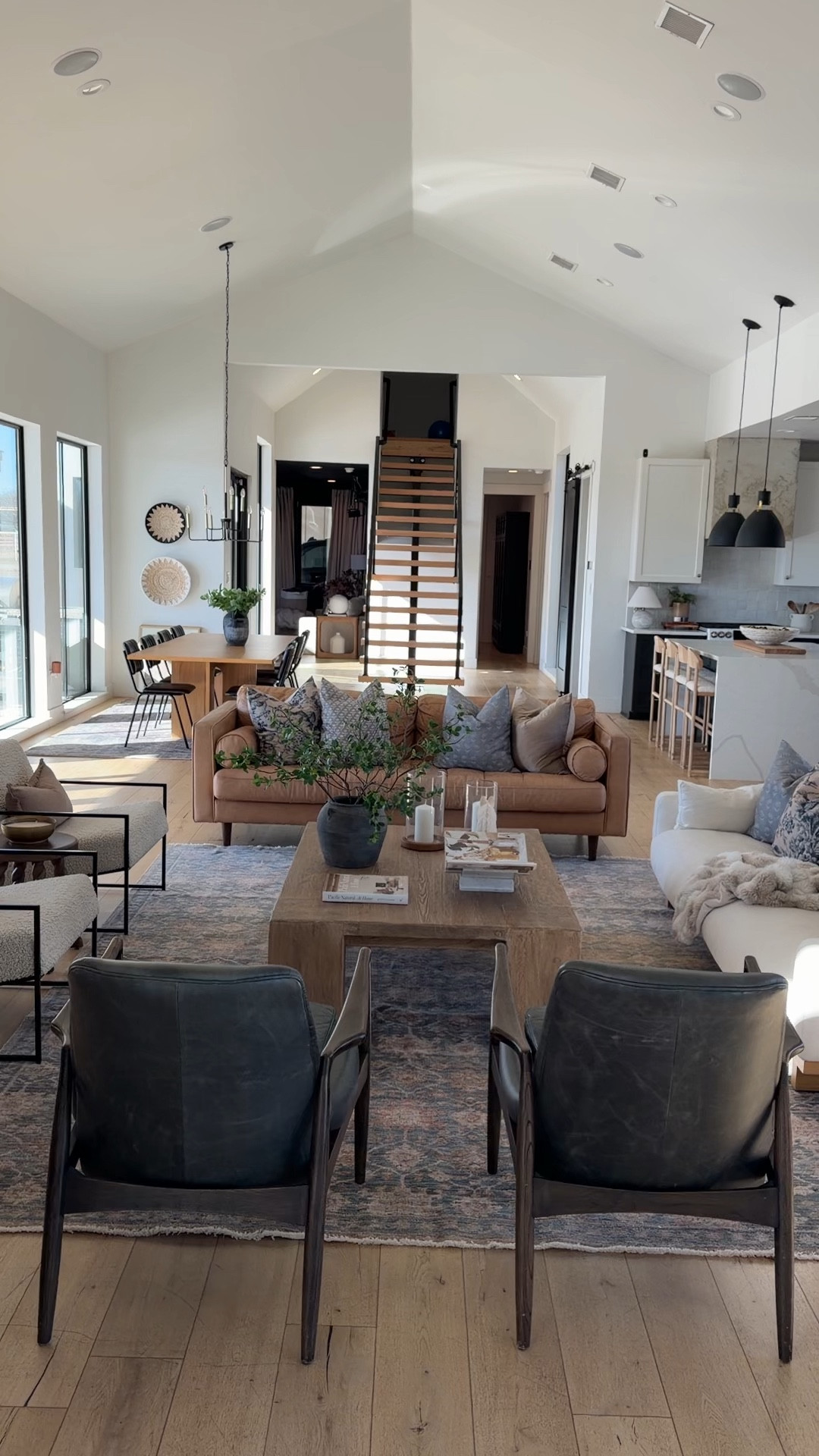 Our living room is designed to feel warm, layered, and welcoming, a space that works for everyday life but still feels elevated. We mixed neutral living room furniture with soft textures, natural wood tones, and cozy accents to create a room that feels calm and lived in.

The combination of a leather sofa and upholstered seating, a large area rug, and a wood coffee table grounds the space while keeping it open and inviting. Layered throw pillows, cozy blankets, and simple coffee table decor add softness and depth without overwhelming the room. I love using neutral colors and natural materials to keep everything timeless and easy to refresh season to season.

If you’re looking for living room inspiration, neutral home decor ideas, or a cozy, modern living room that feels both functional and beautiful, this space has become one of my favorite rooms in our home. 

#LTKSaleAlert #LTKHome #LTKSeasonal