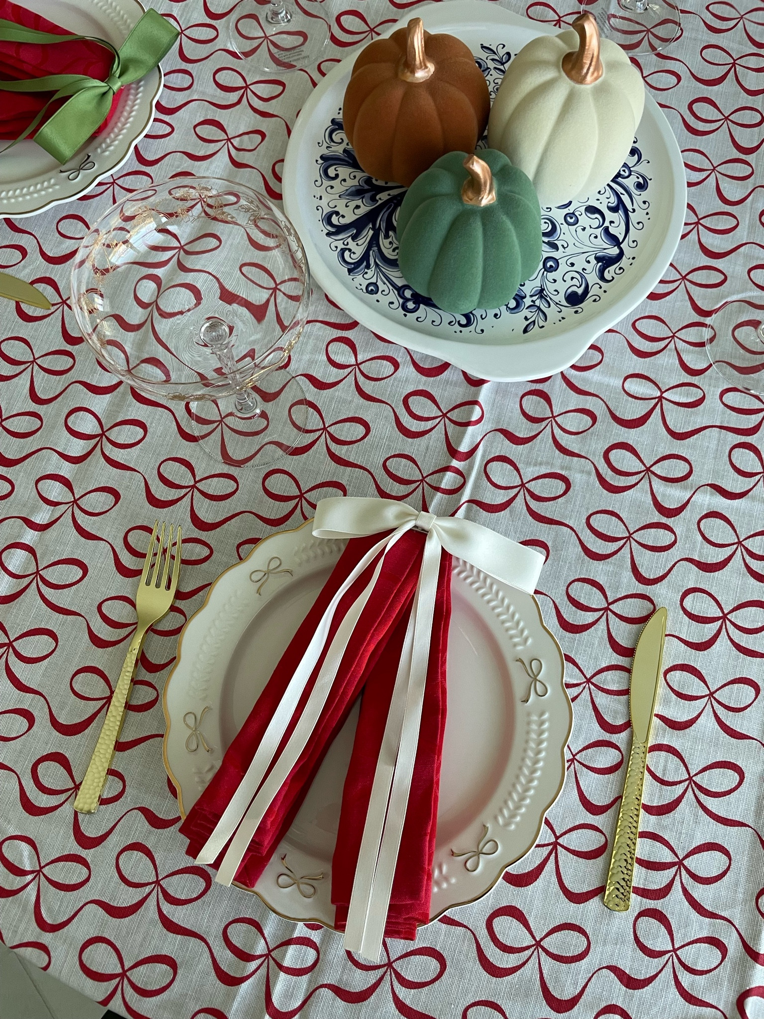 Thanksgiving table scape. Bow tablecloth, napkins, and plates  