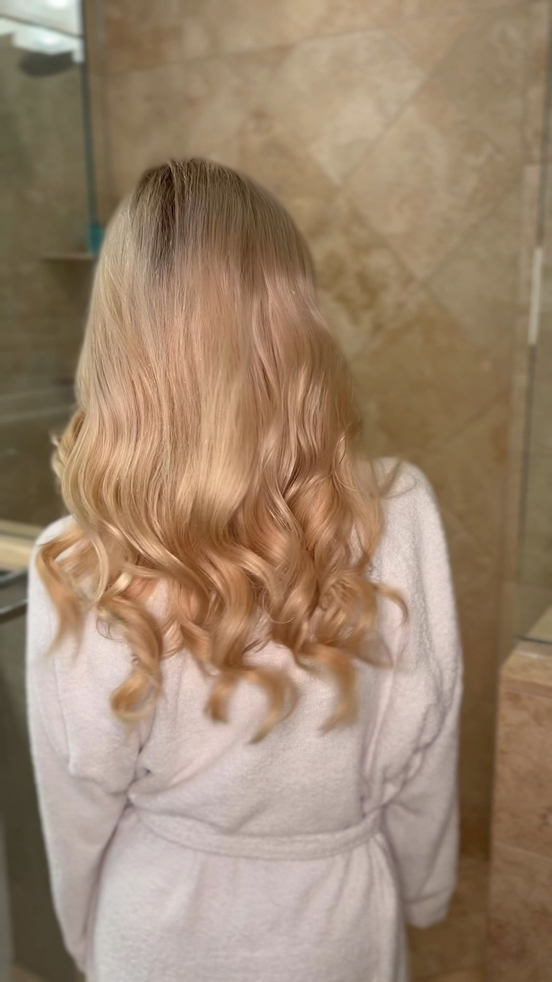 “I can’t, I have to wash my hair…” 

Here’s the deets on how to do my Dyson Airwrap hair routine 🎀

Step 1: Double wash 💆🏼‍♀️🚿
I always, always double cleanse my hair for extra clean, fresh, voluminous results. This makes such a difference for curl longevity and scalp health.

Step 2: Air dry 🌬️
I let my hair air dry most of the way (to 80%). In the meantime I’ll apply skincare, do a little office work, or play with Teddy.  Less heat = healthier hair.

Step 3: Dyson Airwrap 🎀
Using the Dyson curling wand, I start with full air + full heat. Once the hair is wrapped, I quickly drop to medium heat, then always finish with cool air to lock the curl. I let the curls fully set while I finish my whole head.

Step 4: Style ✨
I gently brush out the curls and apply hair oil through the ends with my hands for softness and shine.

The result: Signature bouncy Doll curls 🎀✨