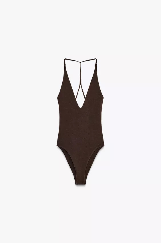 Halter neck bodysuit with plunging v-neck. Strappy back detail. Back snap button closure. | Zara US