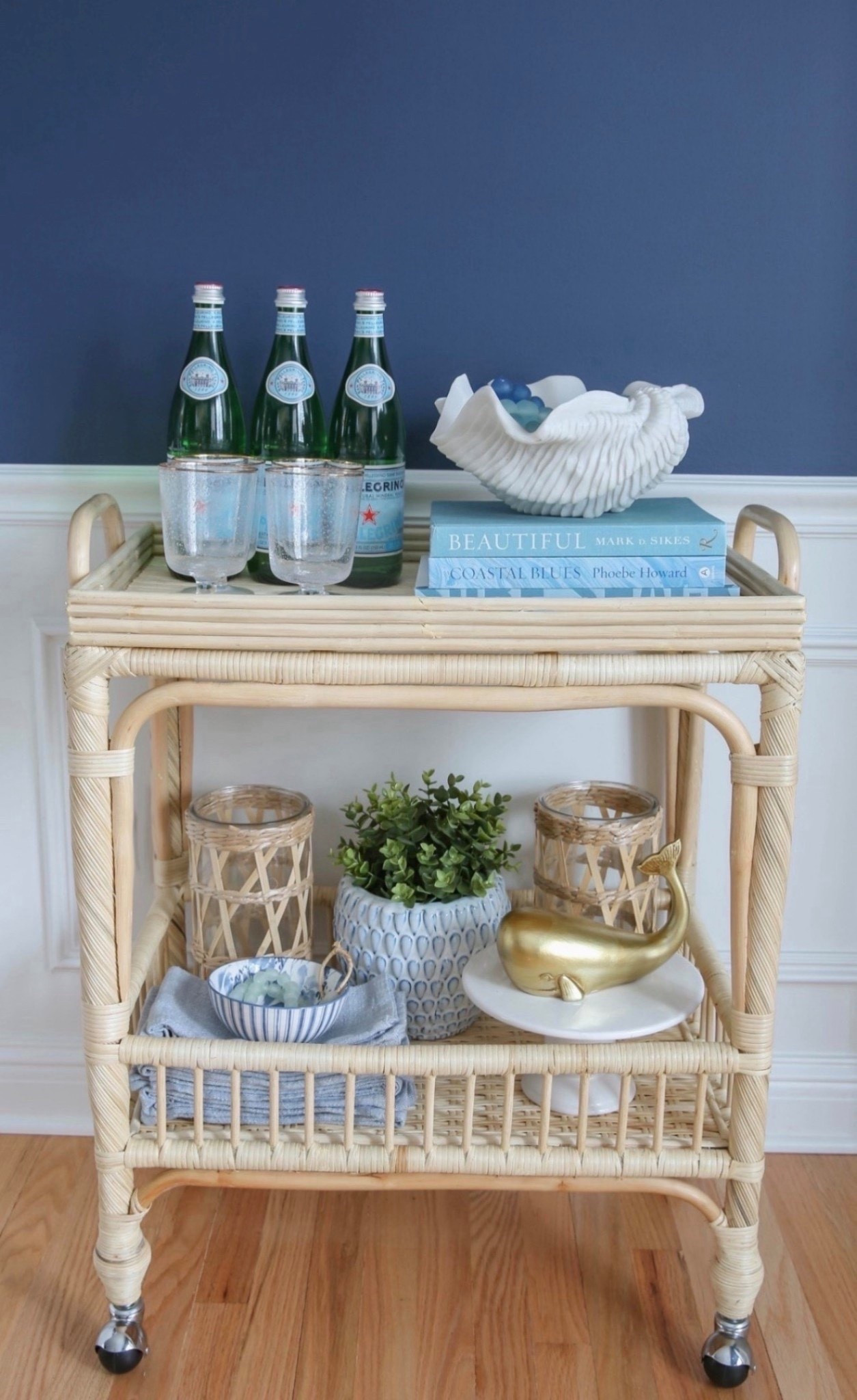 My coastal bar cart is styled with blue and white accents, glassware, and layered decor for a clean, designer-inspired look. I love how it adds personality and function while keeping the space feeling bright, curated, and elevated.  

#LTKSaleAlert #LTKHome #LTKU
